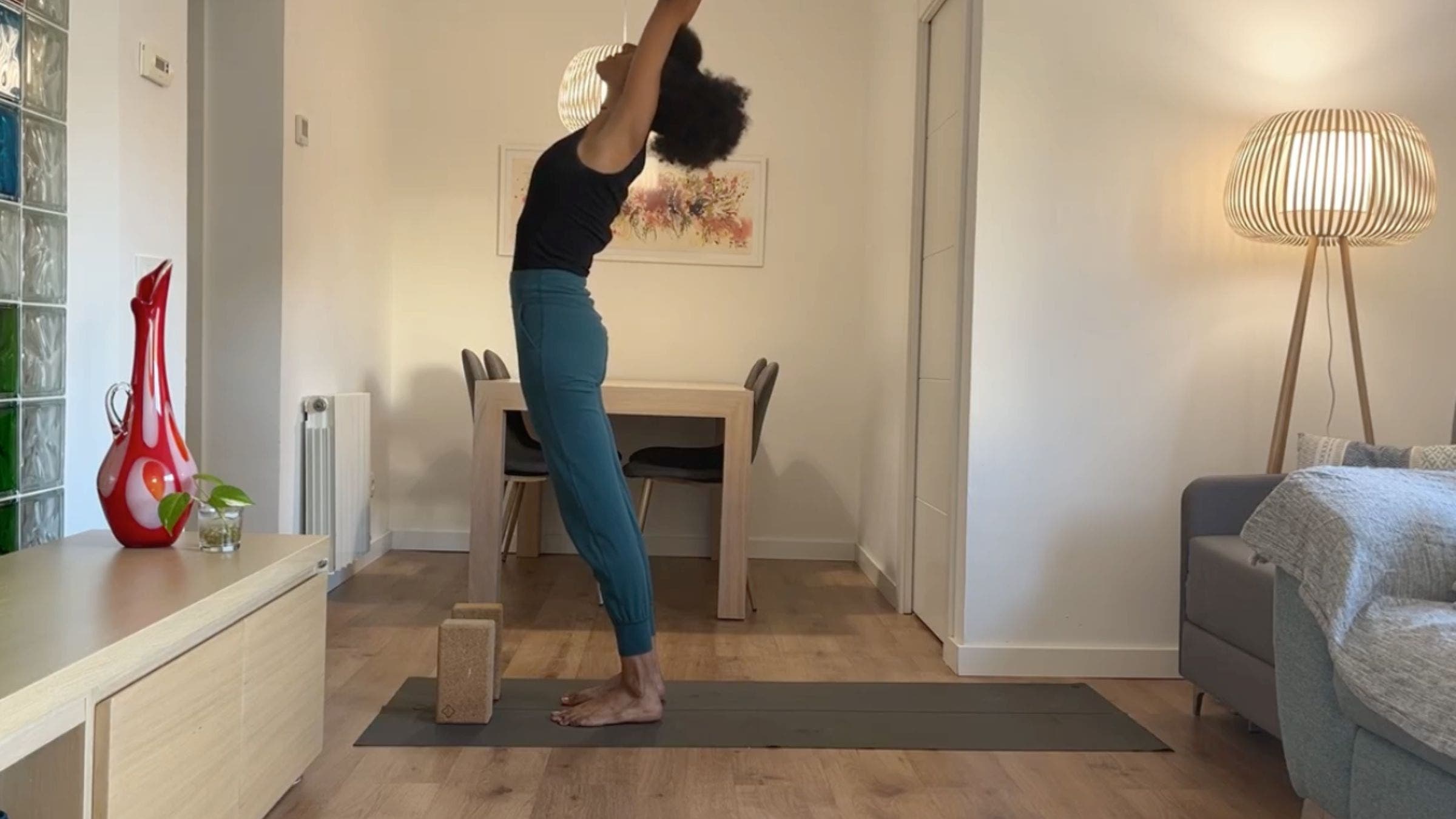 Yoga instructor practicing Upward Salute.