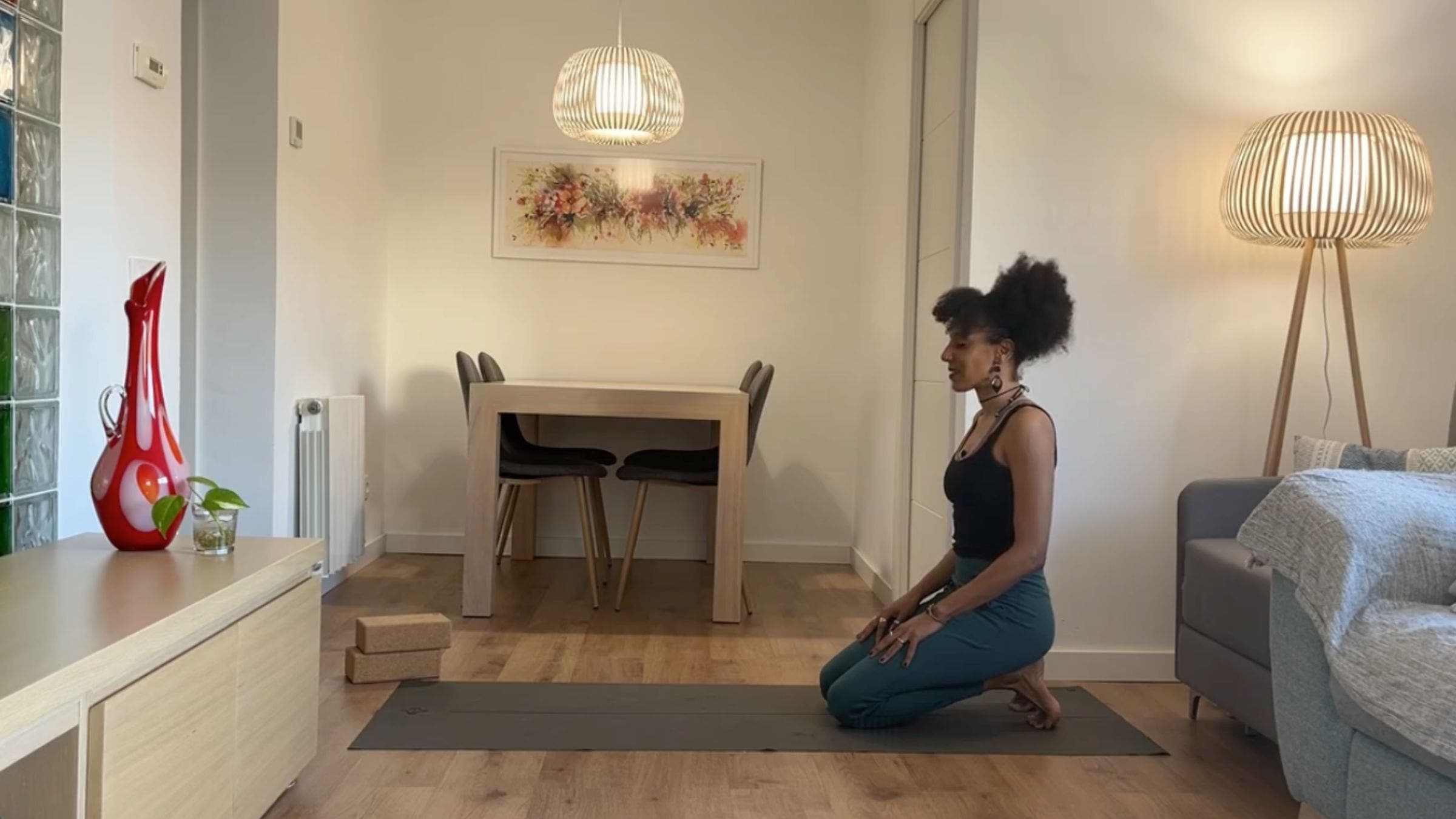 Yoga instructor practicing Toe Squat.