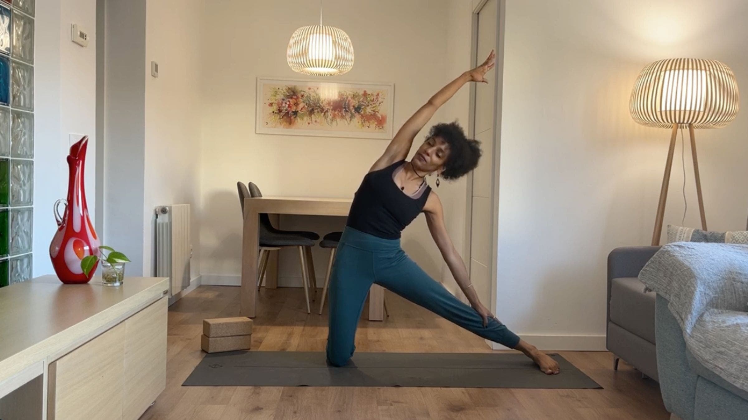 Yoga instructor practicing Gate Pose.