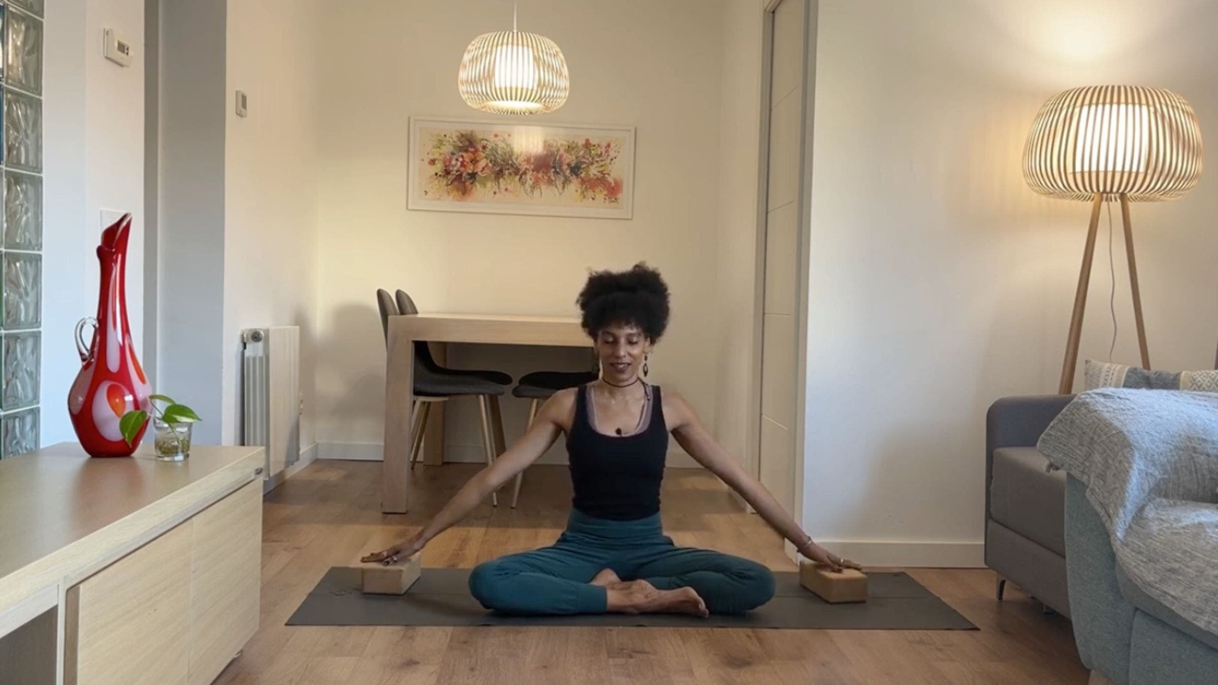Yoga instructor practicing seated stretch.