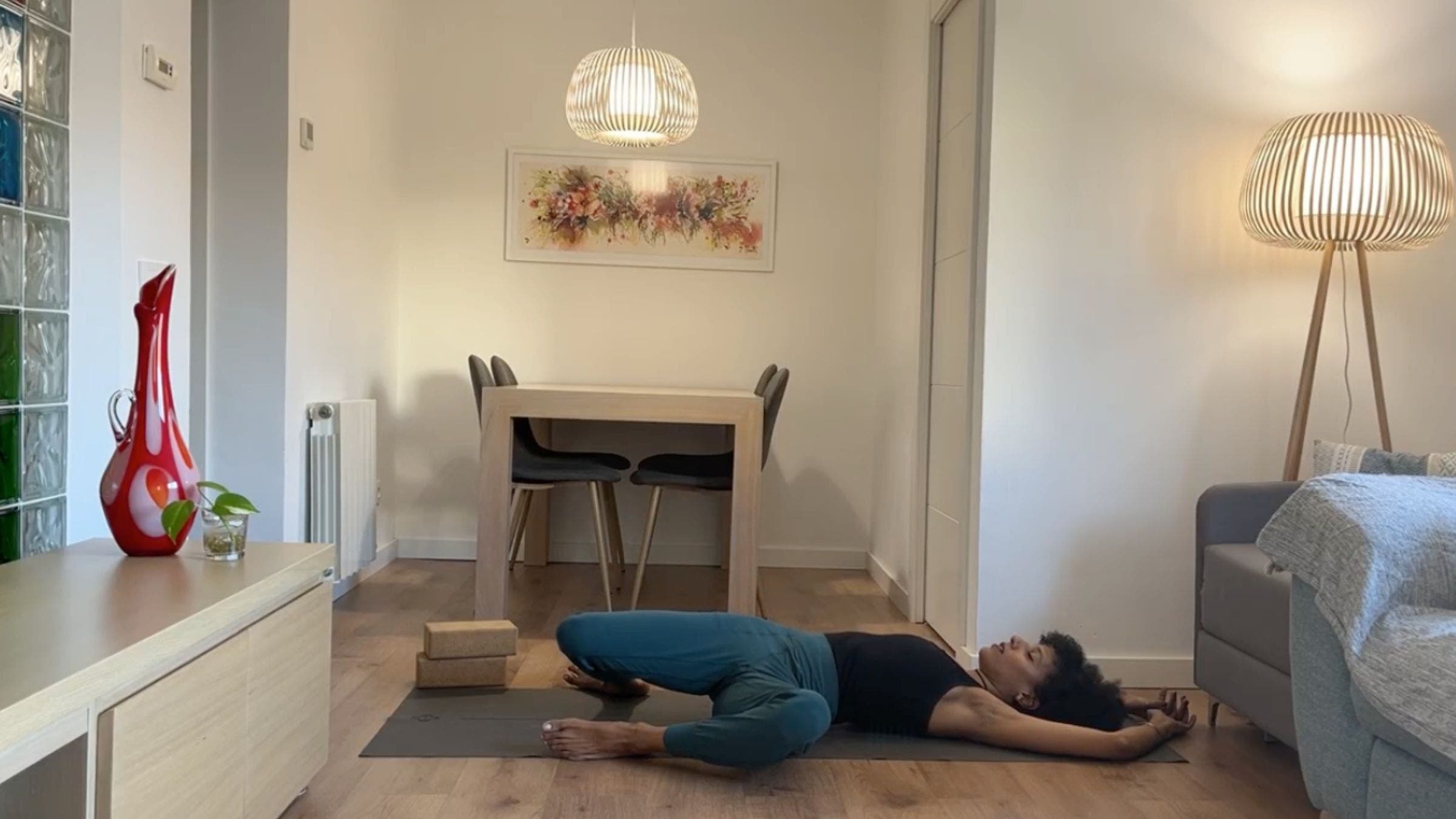 Yoga instructor practicing windshield wipers.