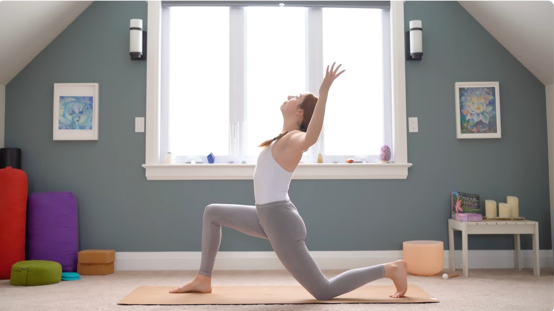Woman kneeling in Low Lunge with her arms in cactus shape