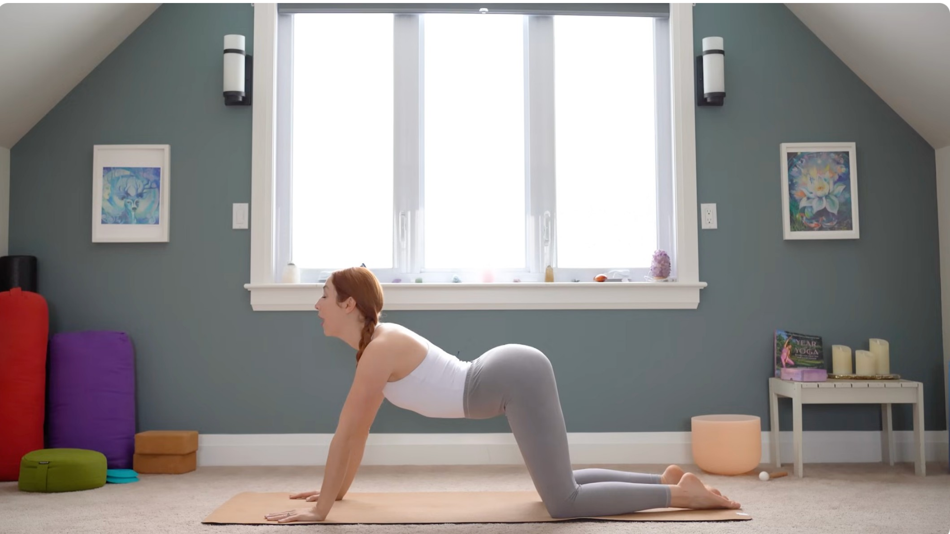 Woman kneeling on a yoga mat during a 15-minute yoga practice