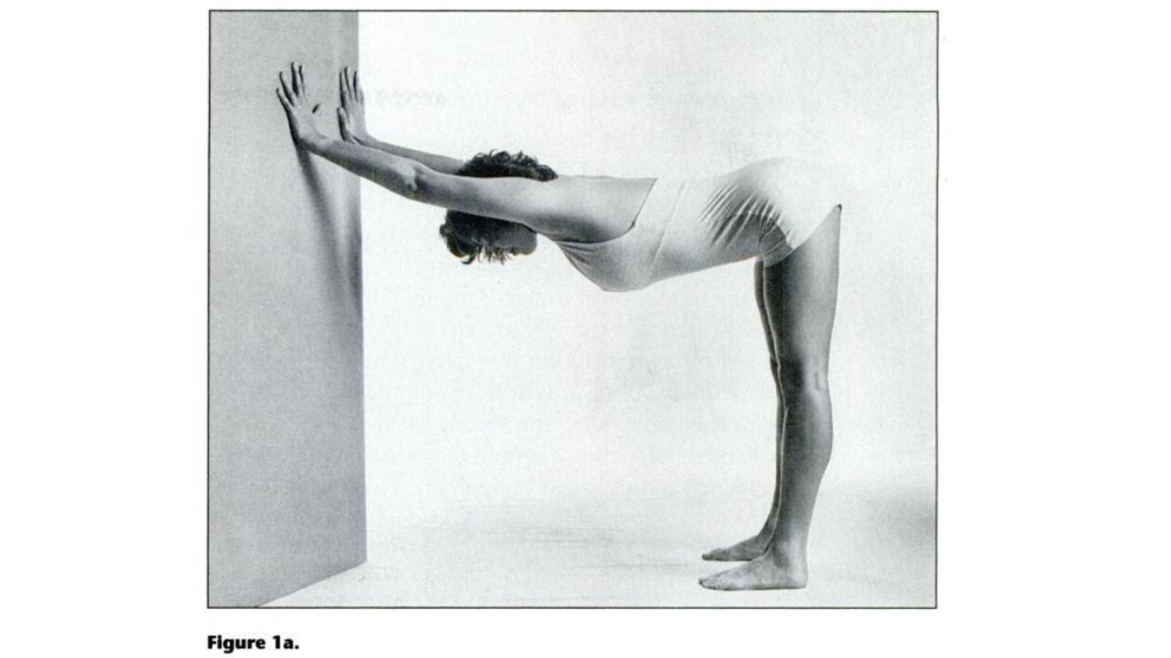 Woman practicing variation of Down Dog for tight shoulders.