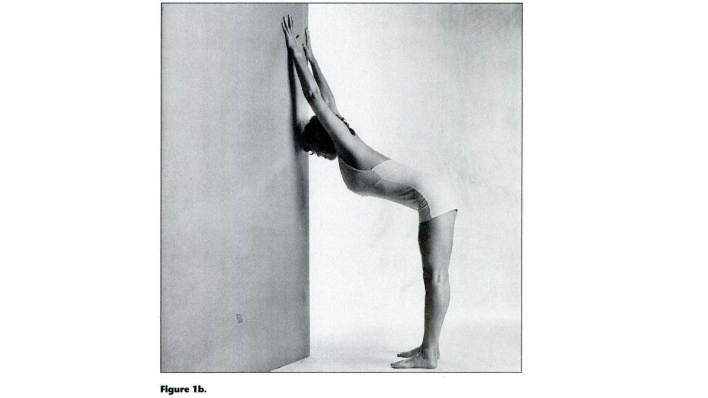 Woman practicing variation of Down Dog for tight shoulders.