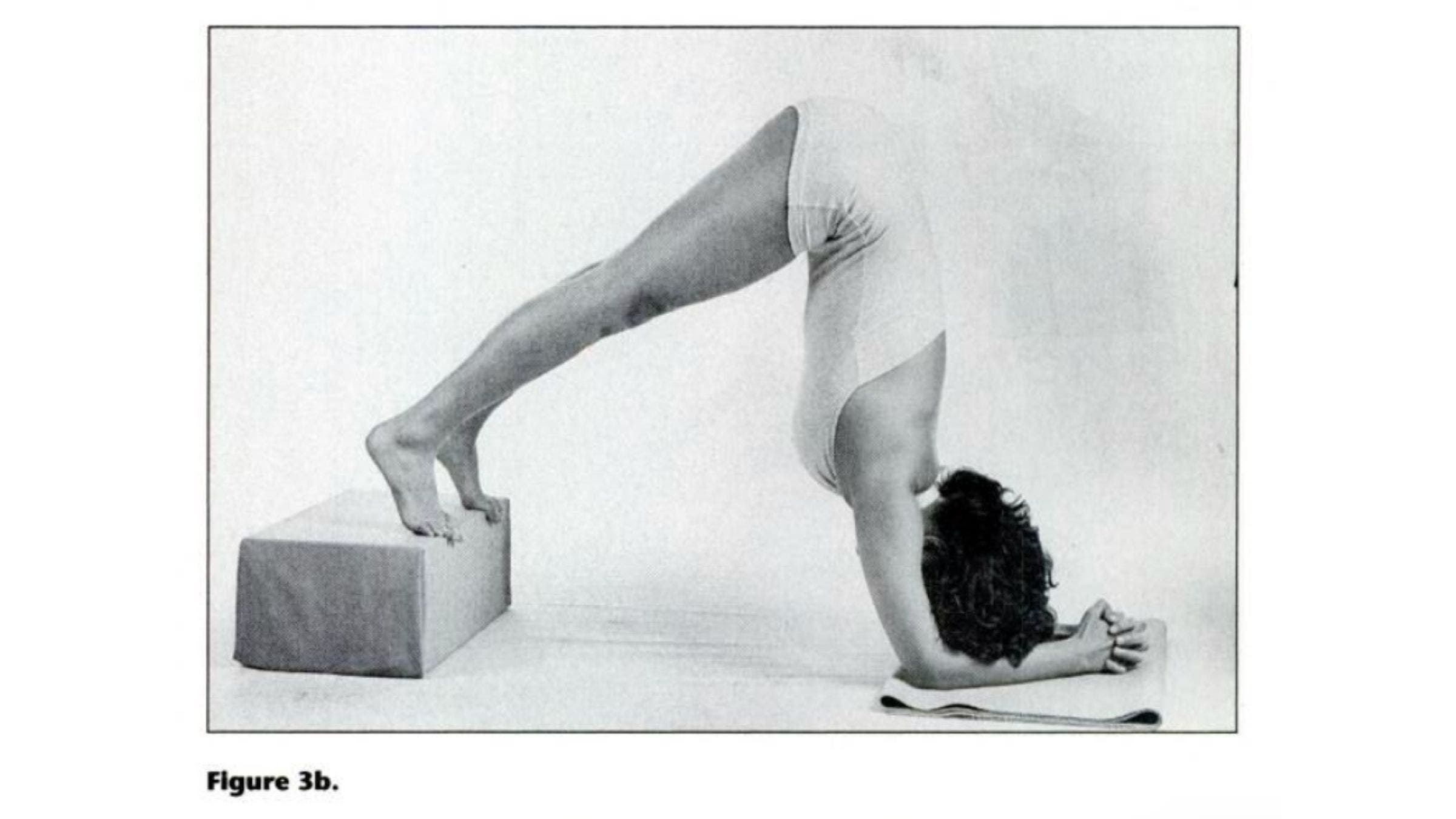 Woman practicing Down Dog variation for tight shoulders.