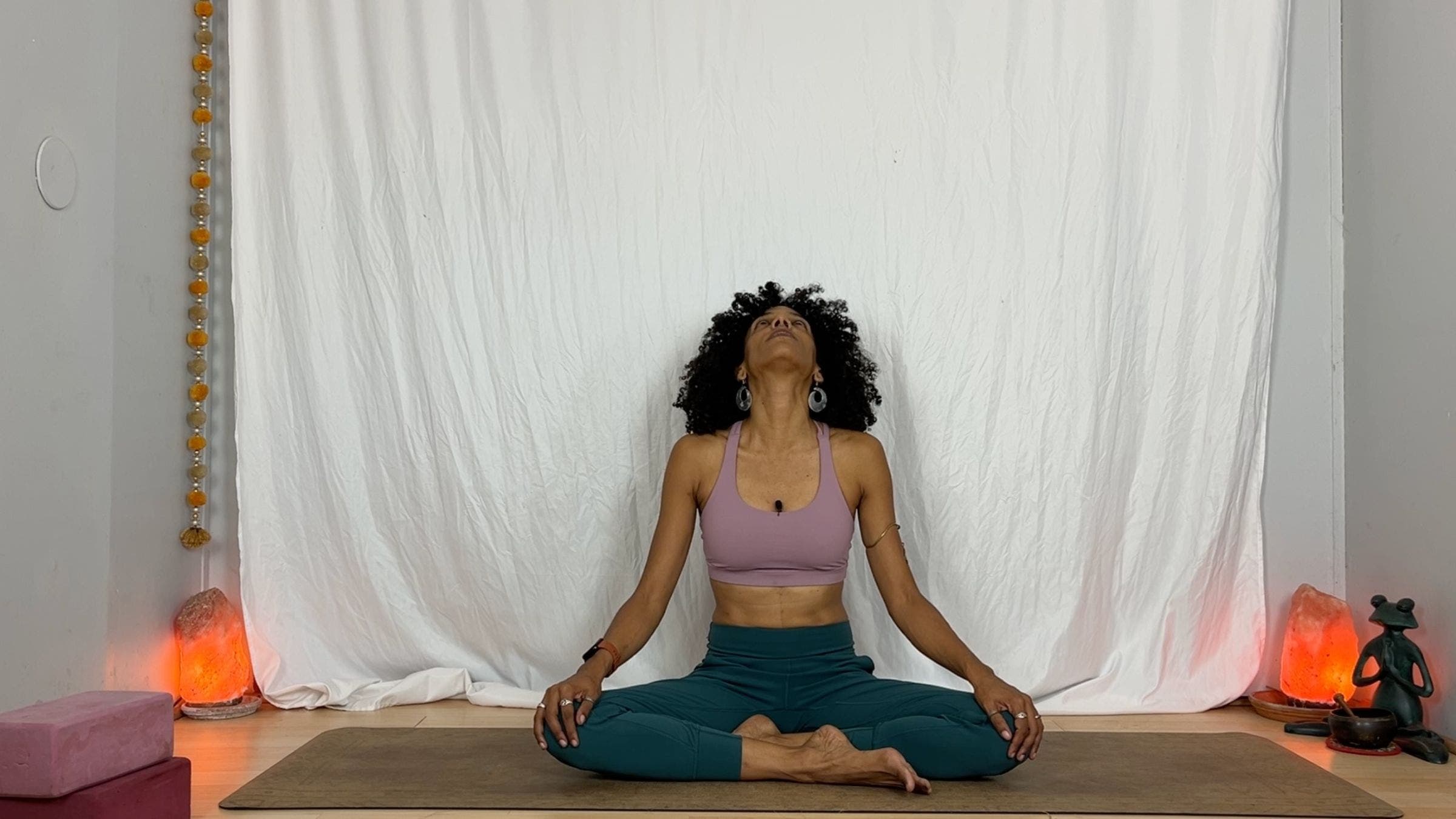 Yoga instructor practicing neck stretching exercises.