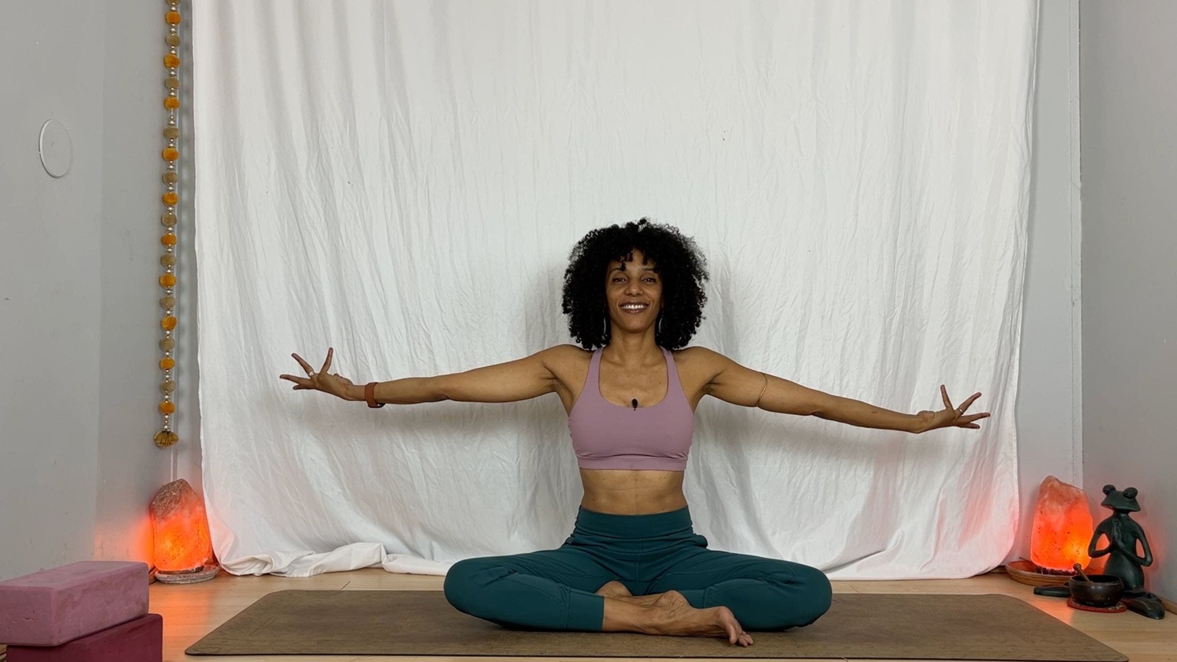 Yoga instructor practicing arm rotation.