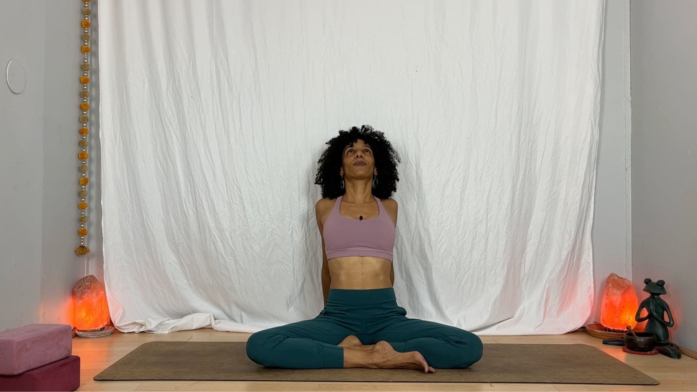 Yoga instructor practicing chest lift exercise.