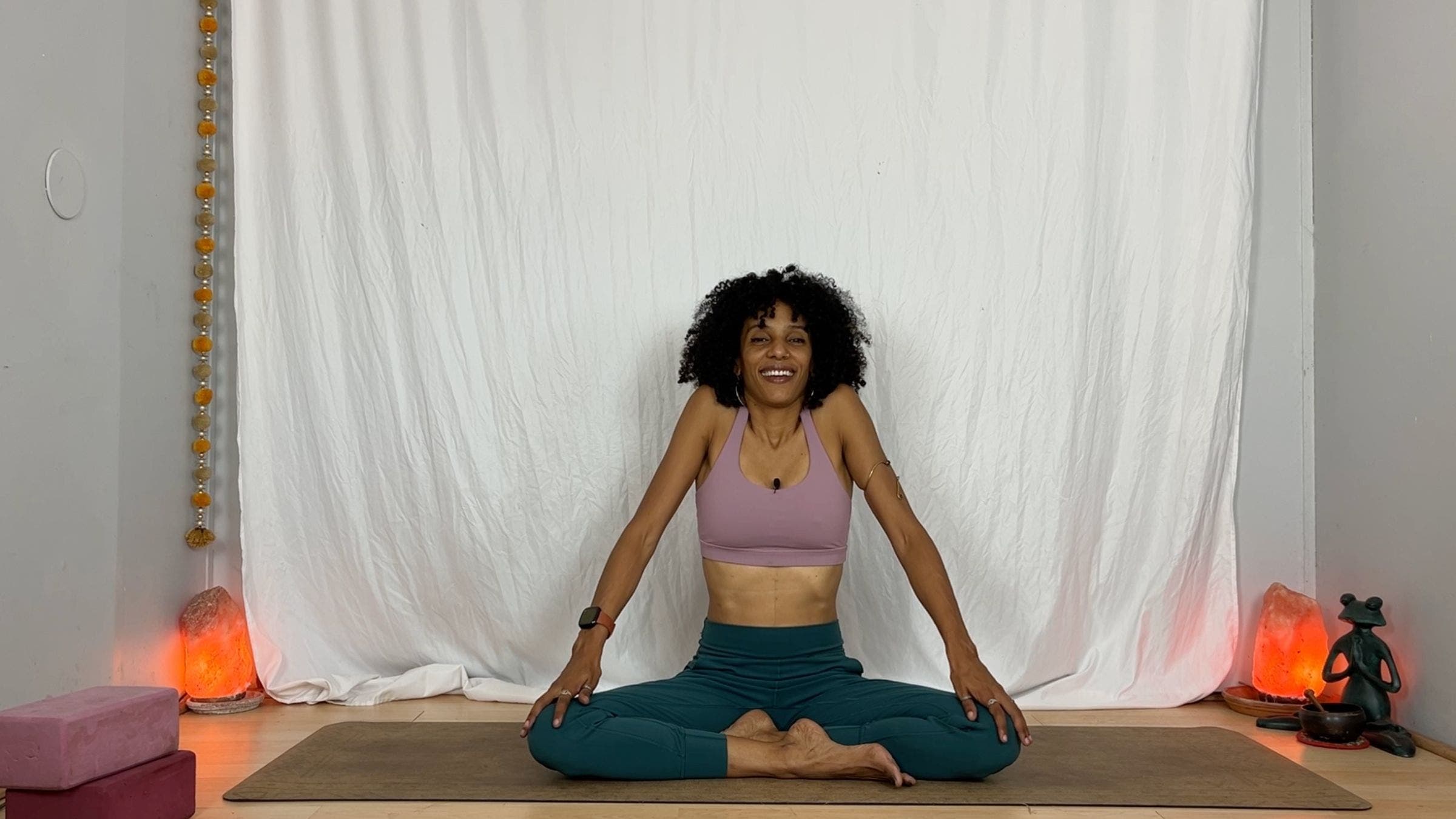 Yoga instructor practicing shoulder circles.