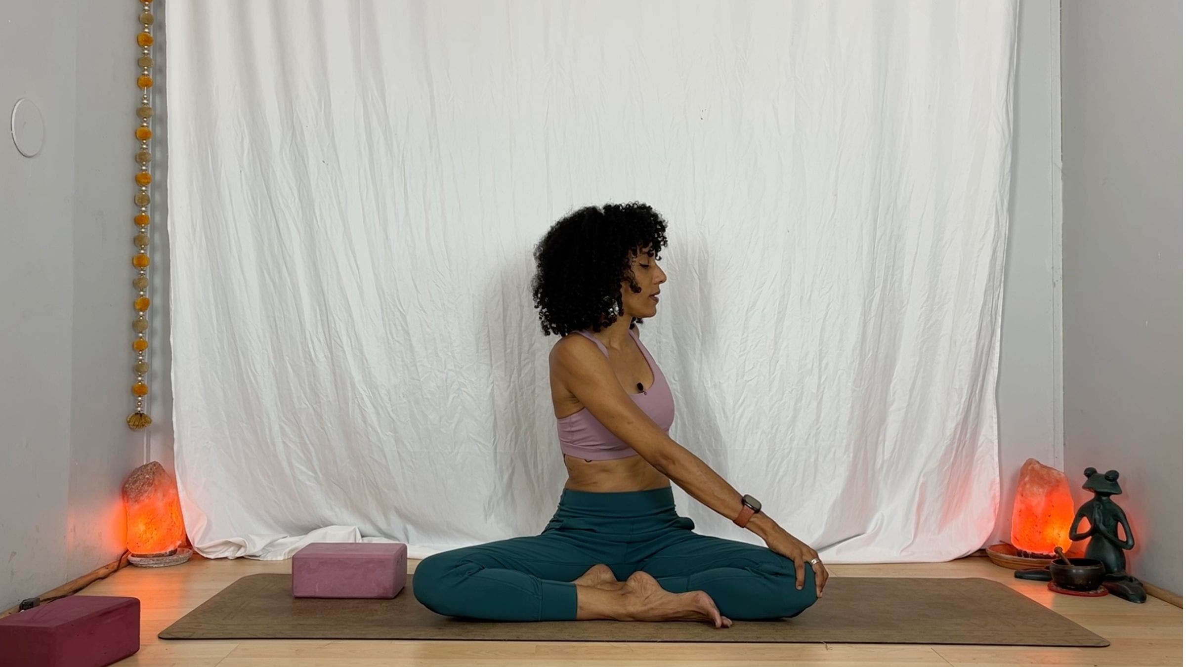 Yoga instructor practicing seated twists.