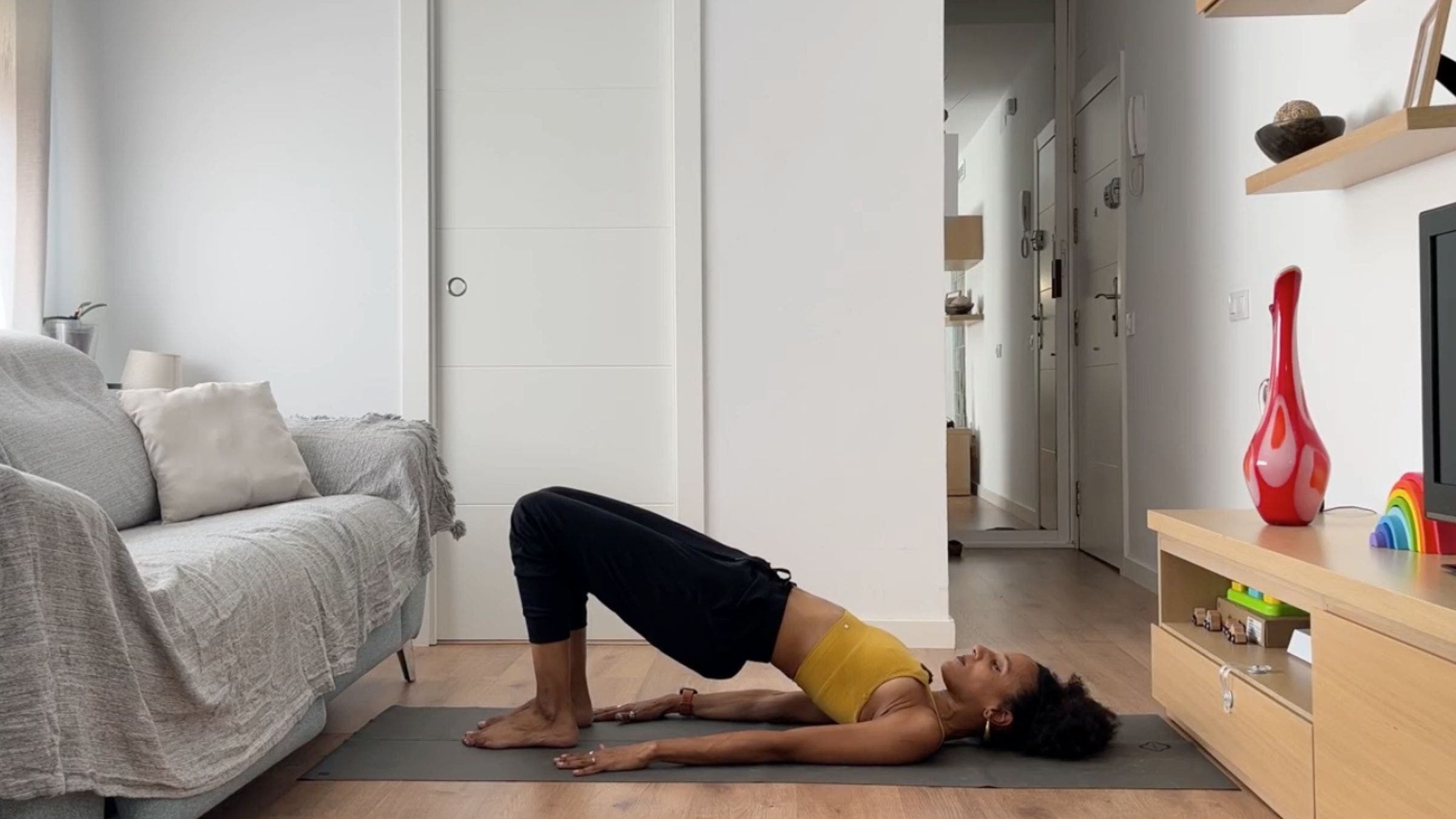 Woman practicing Bridge Pose.