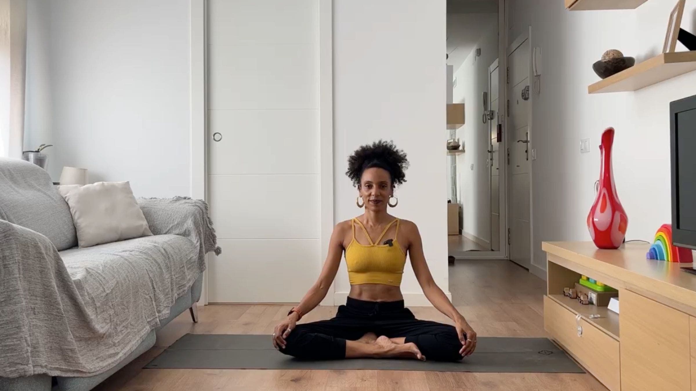 Woman practicing Easy Pose.