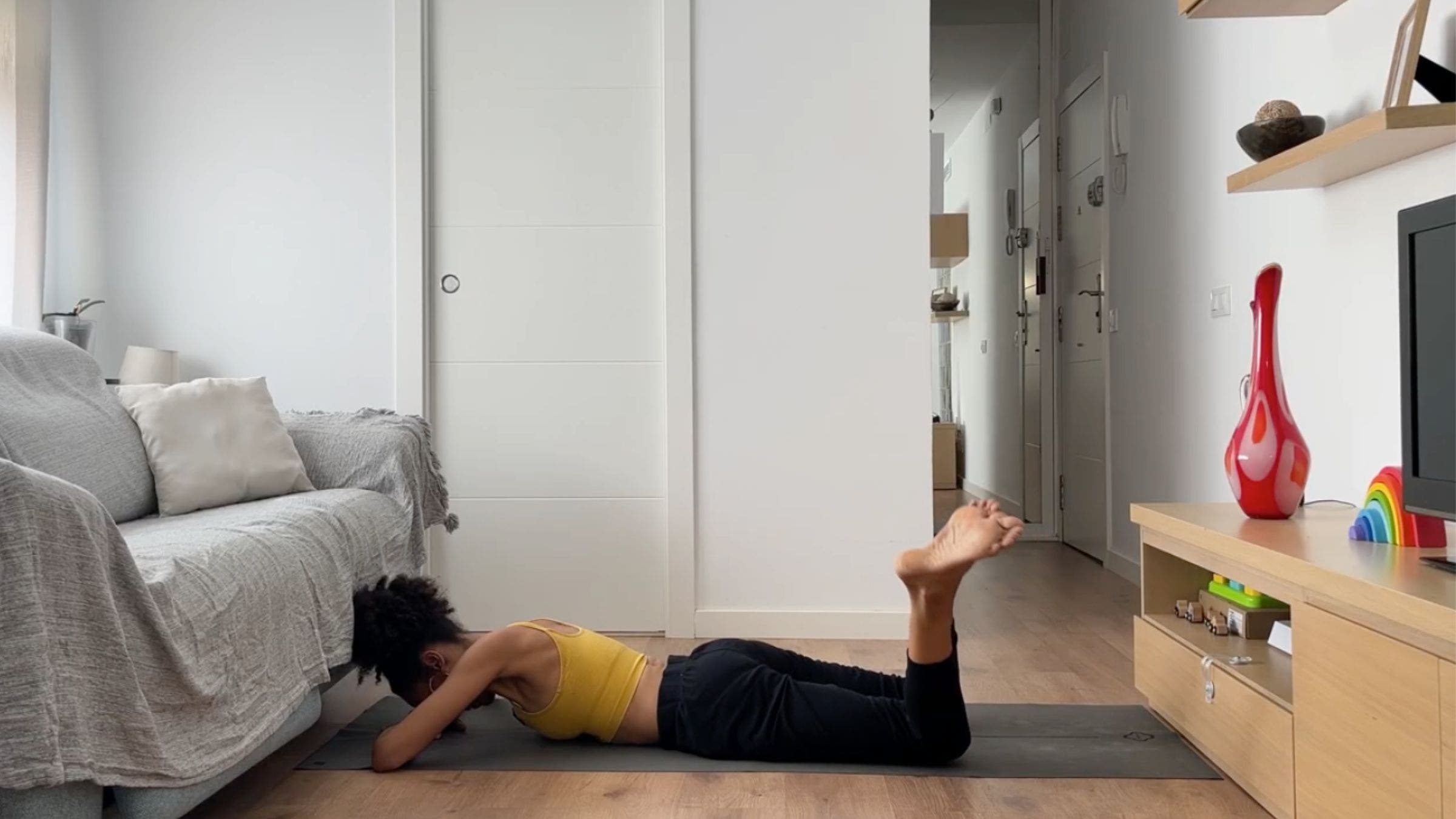 Woman practicing prone windshield wipers.