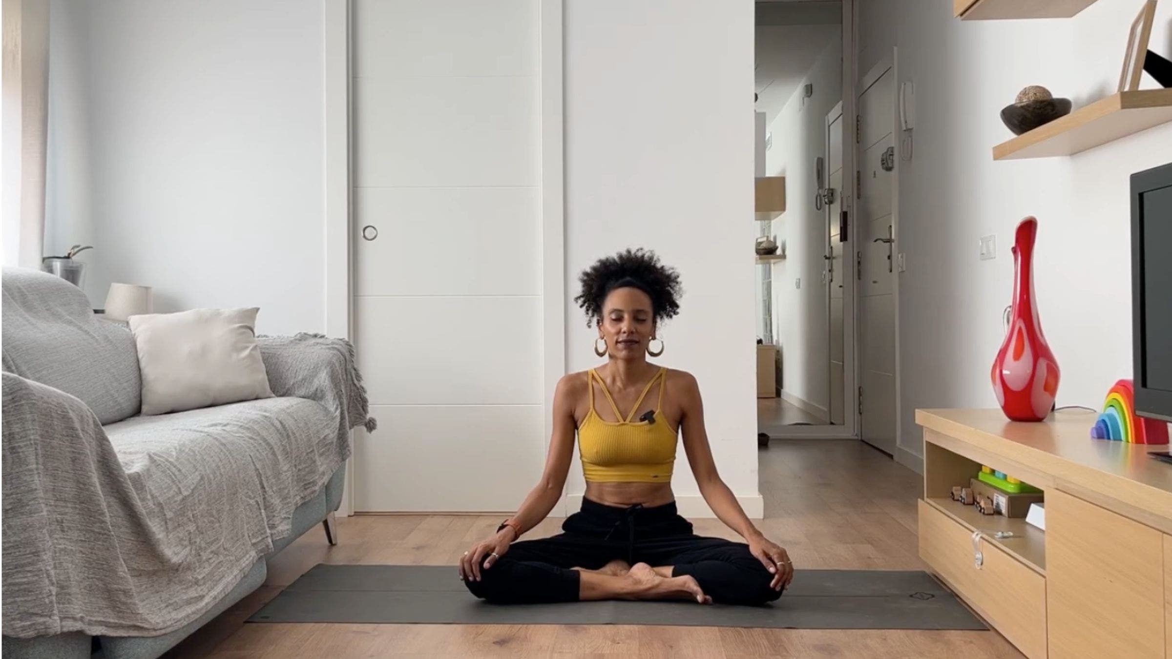 Woman practicing Easy Pose.