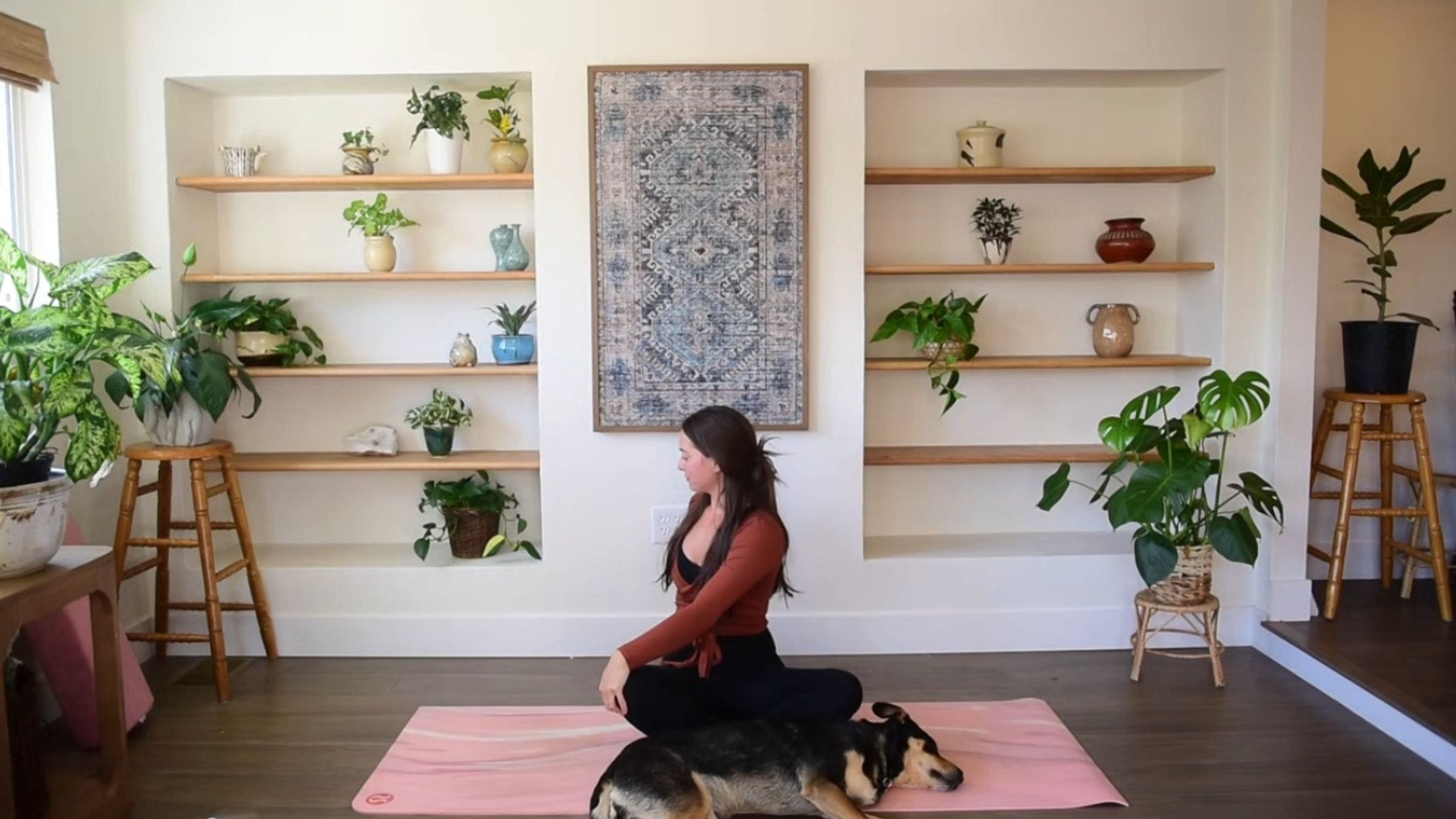 Yoga instructor Caitlin K'eli practicing seated twist.
