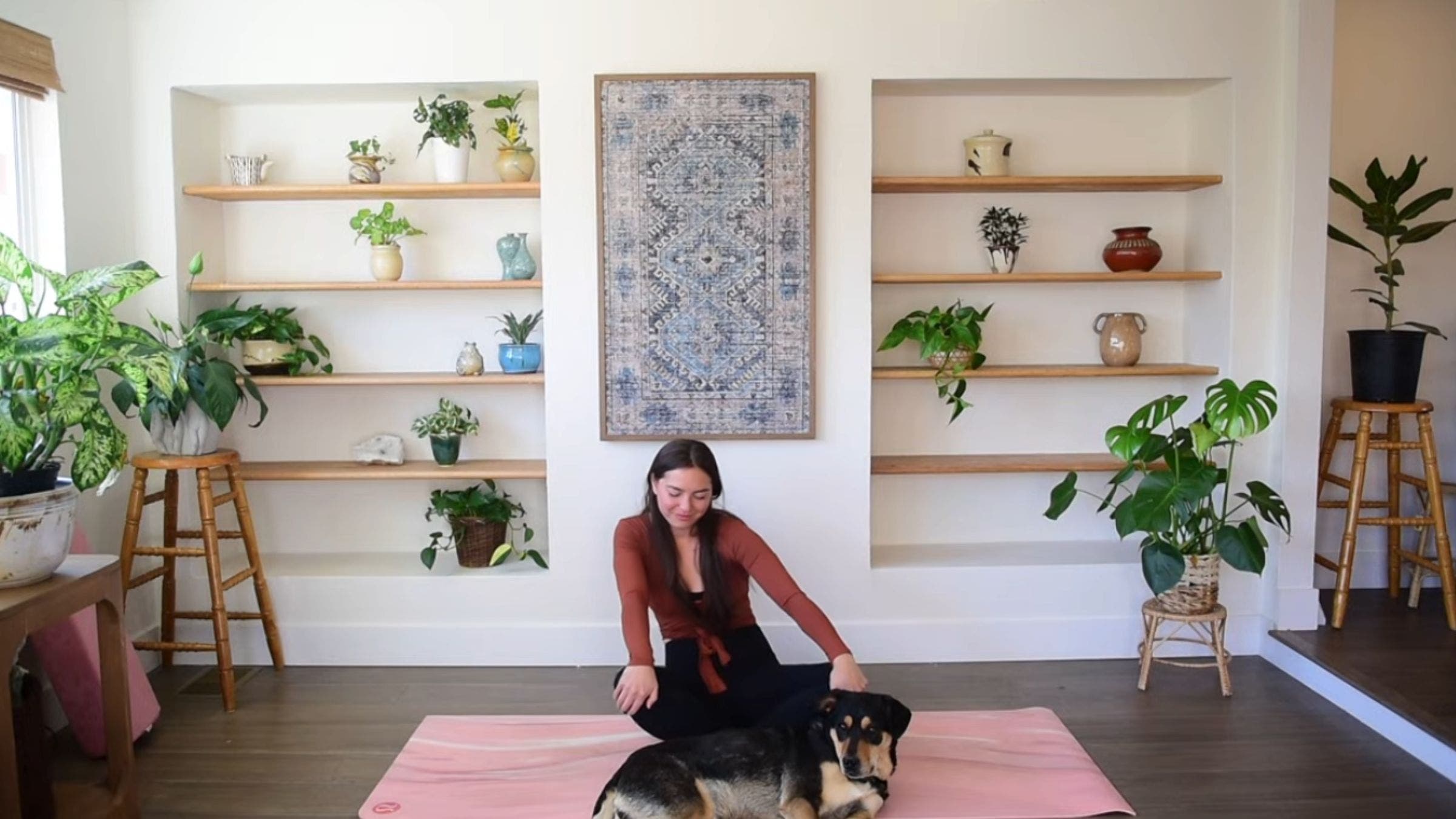 Yoga instructor Caitlin K'eli practicing seated torso circles.
