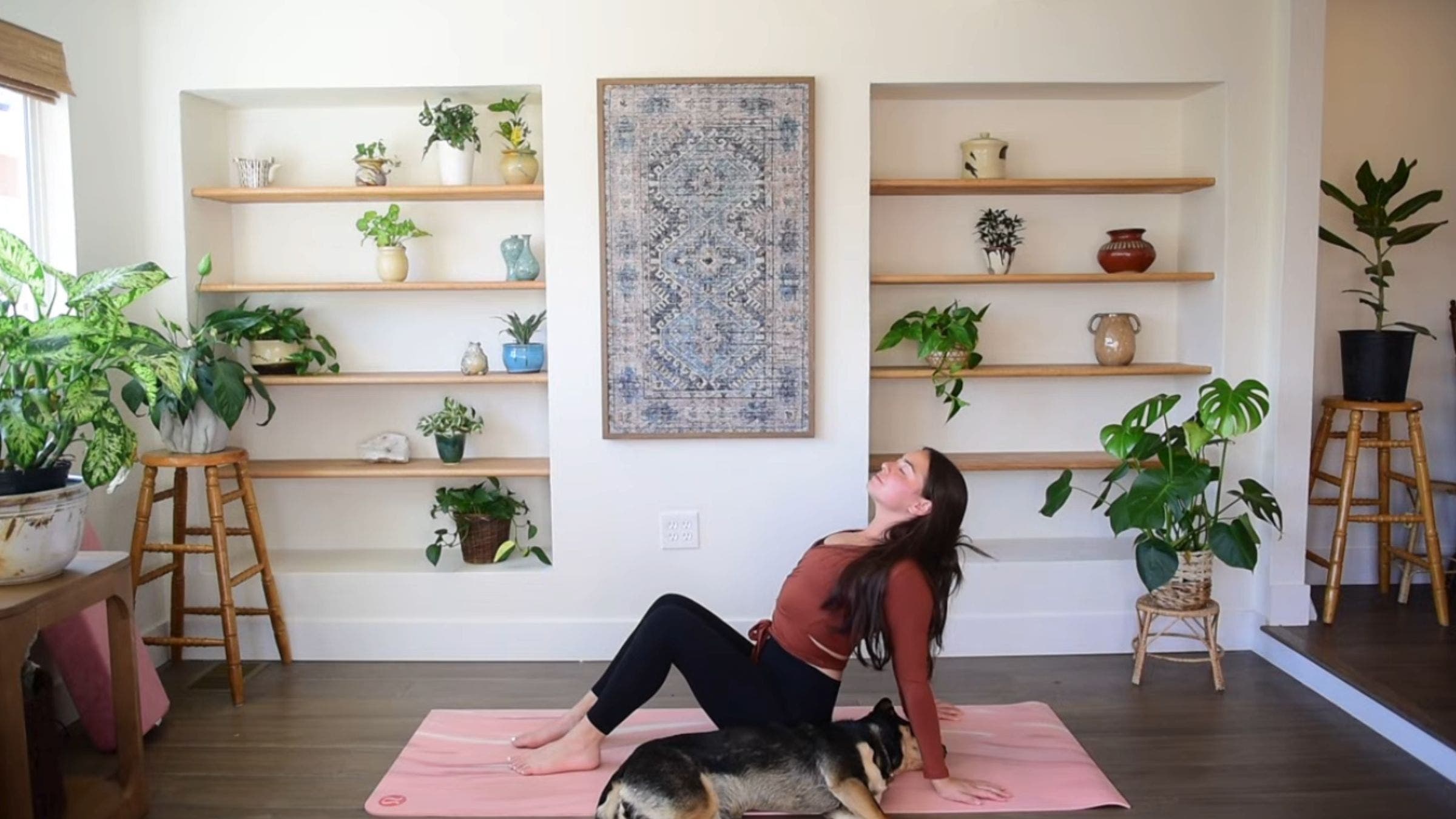 Yoga instructor Caitlin K'eli practicing seated chest stretch.
