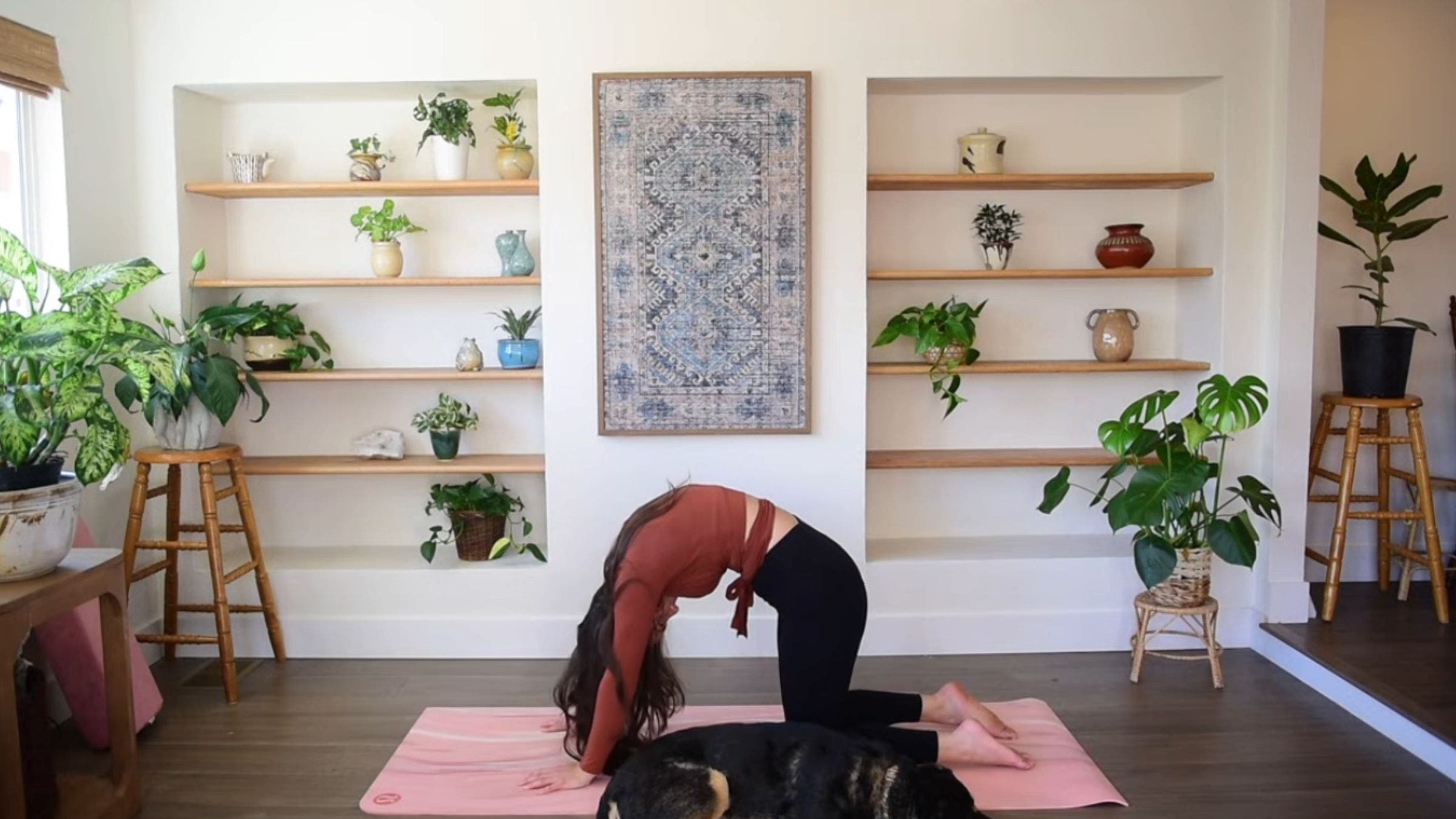 Yoga instructor Caitlin K'eli practicing Cow Pose.