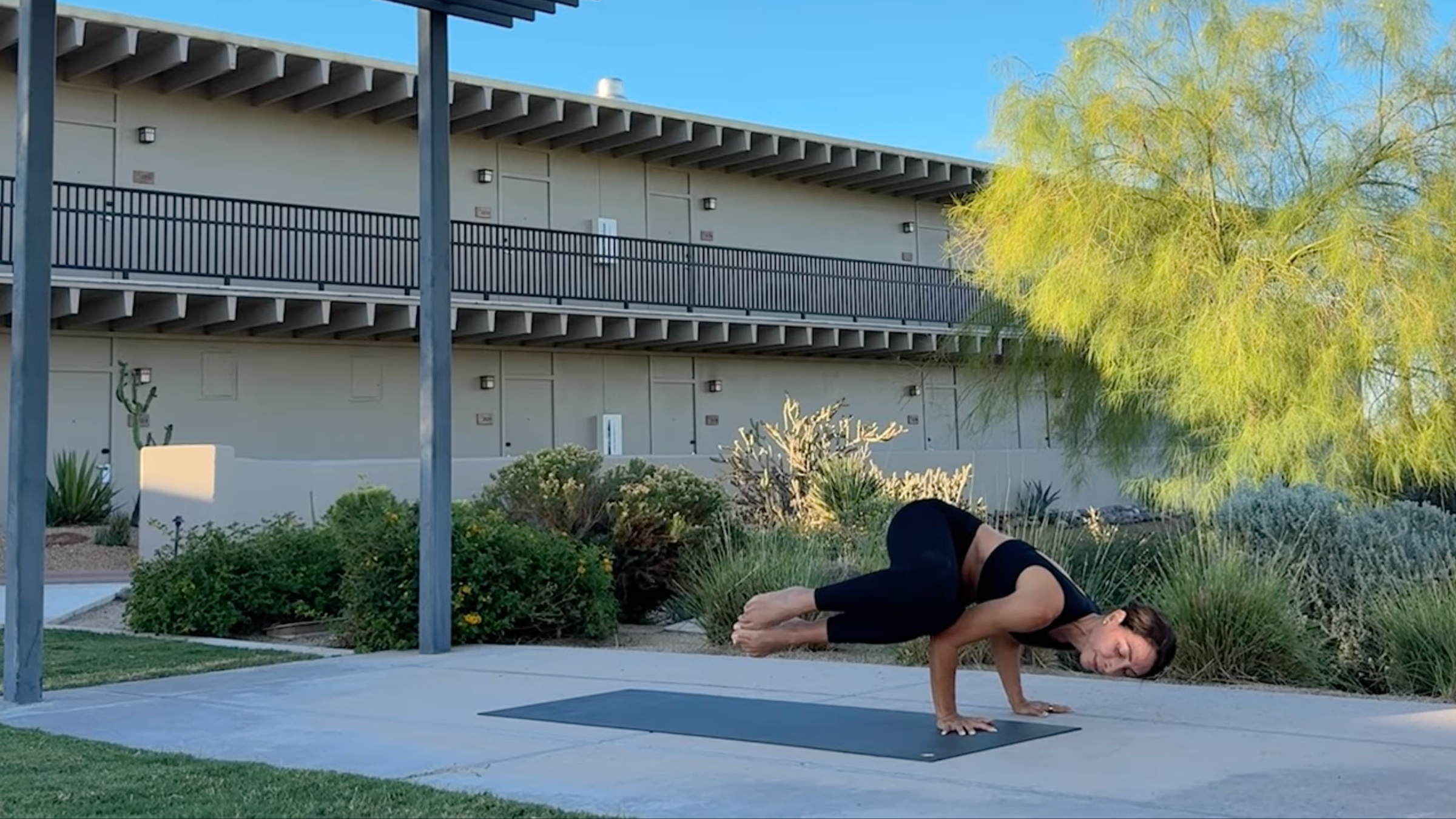 Yoga teacher Cathy Madeo wears the Side Crow, one of the most popular arm balances