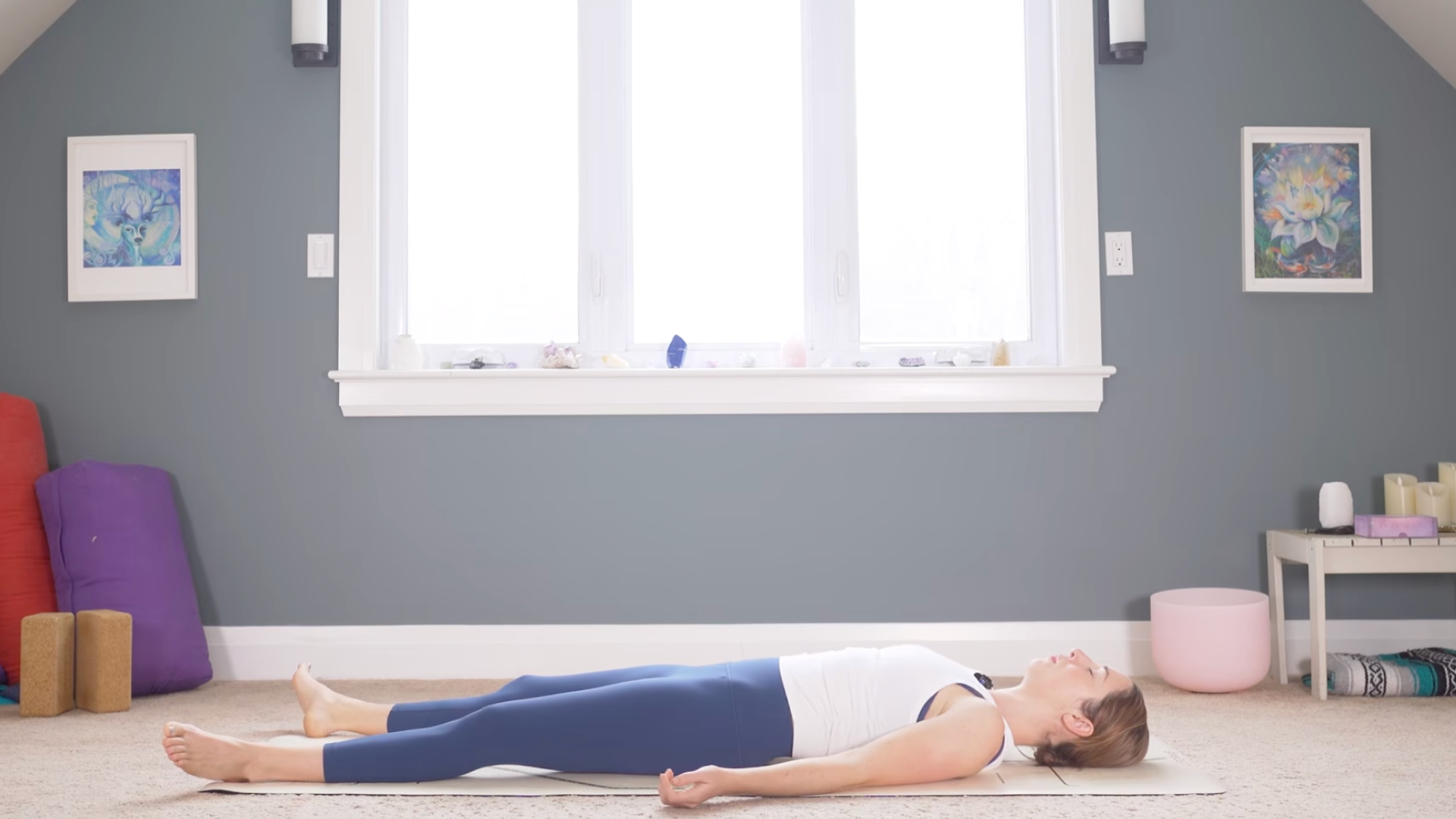 Woman lying back in Savasana Pose