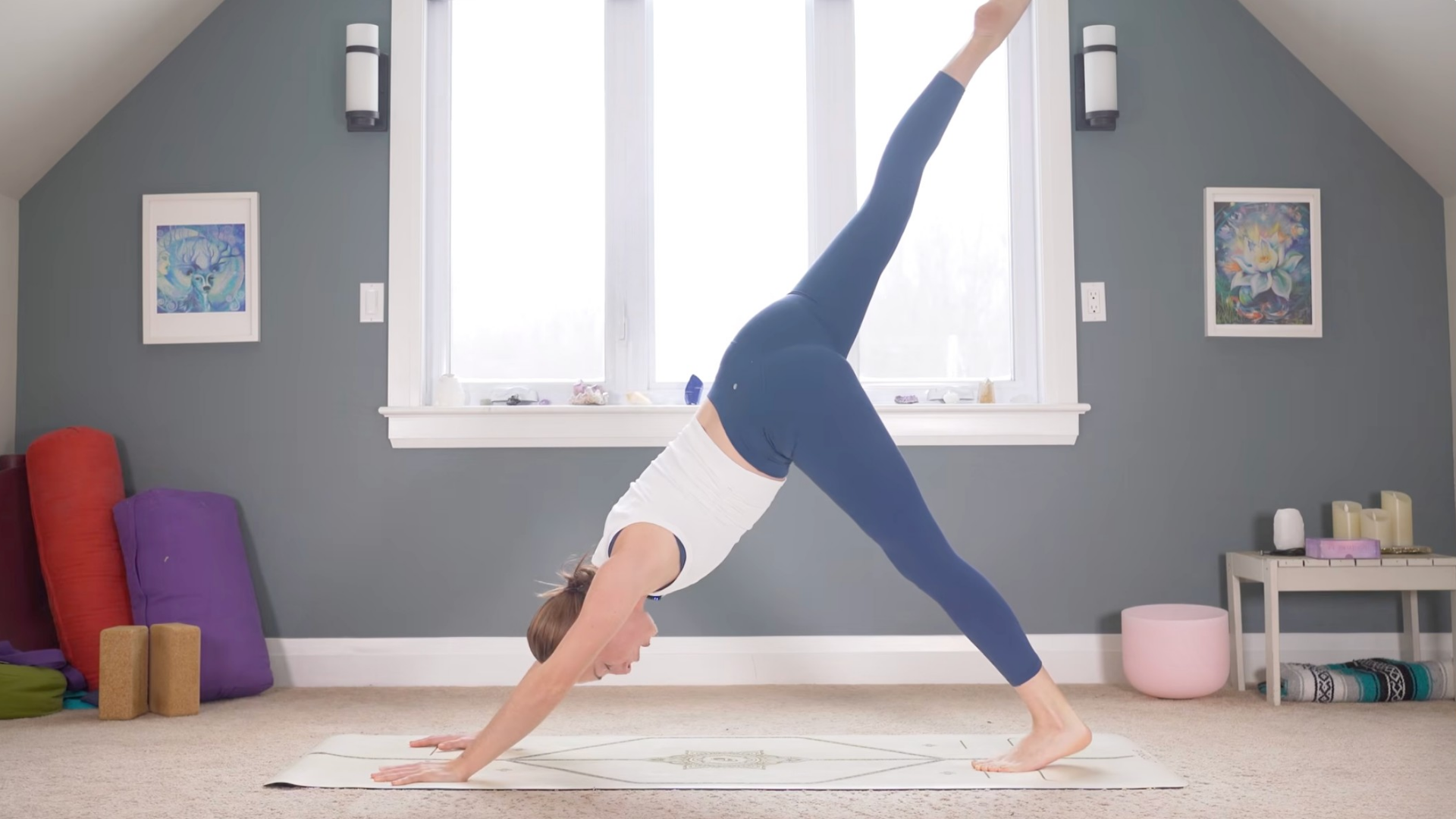 Woman in Three-Legged Dog with her right leg lifted straight behind her