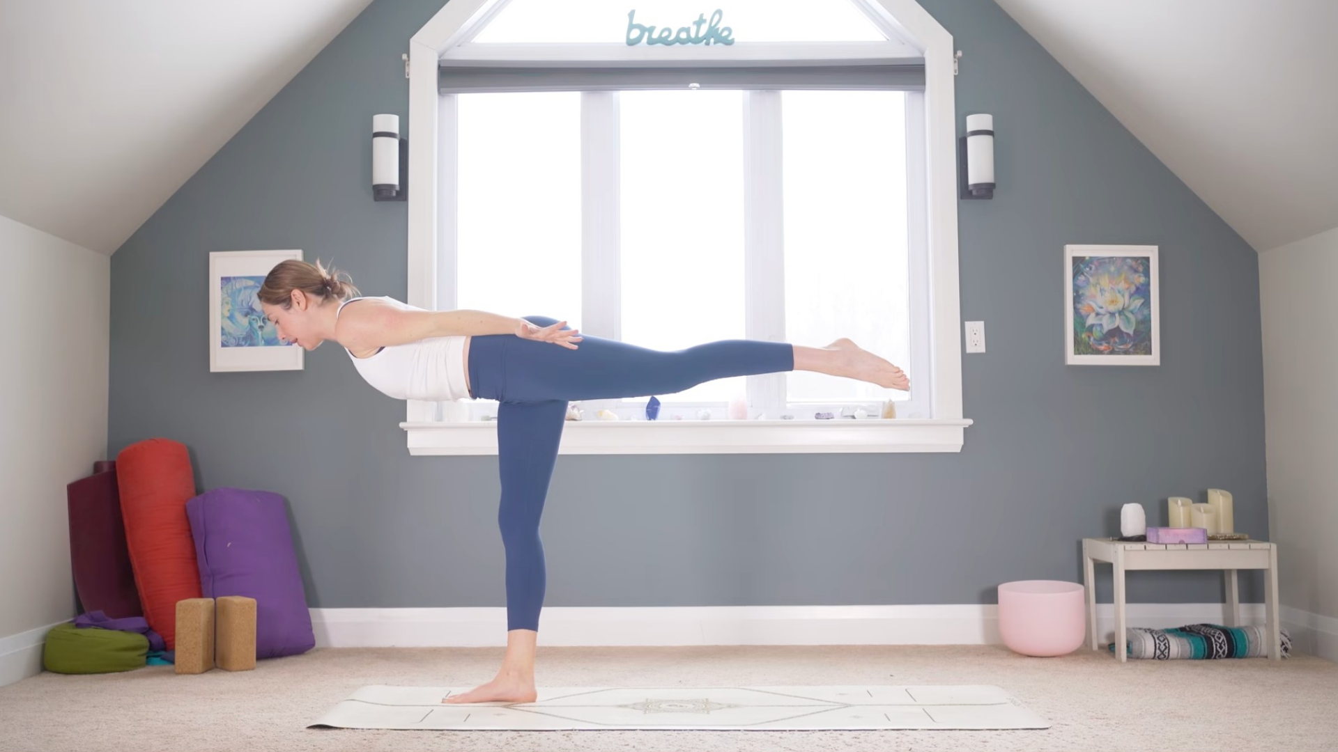 Woman leaning forward in Warrior 3 Pose