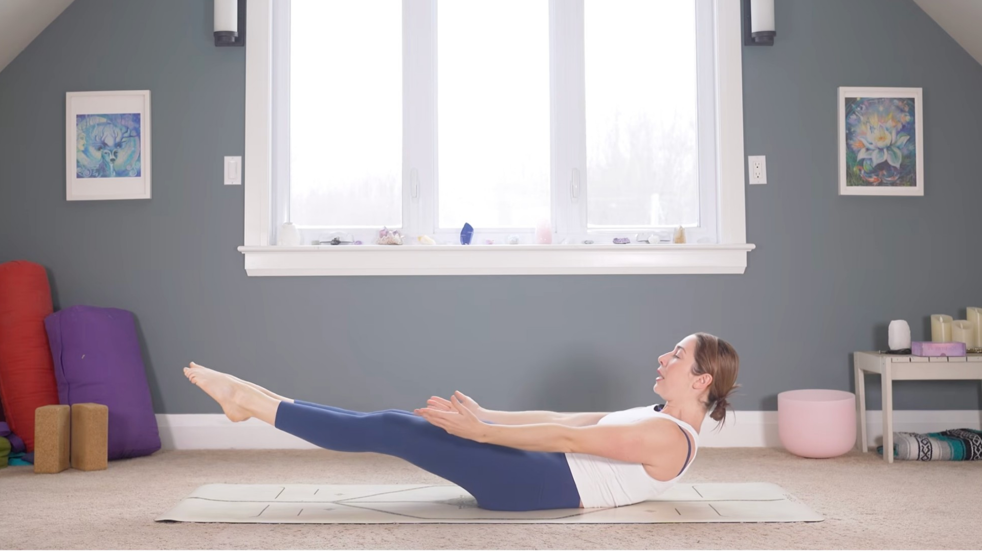 Woman lying in Low Boat Pose