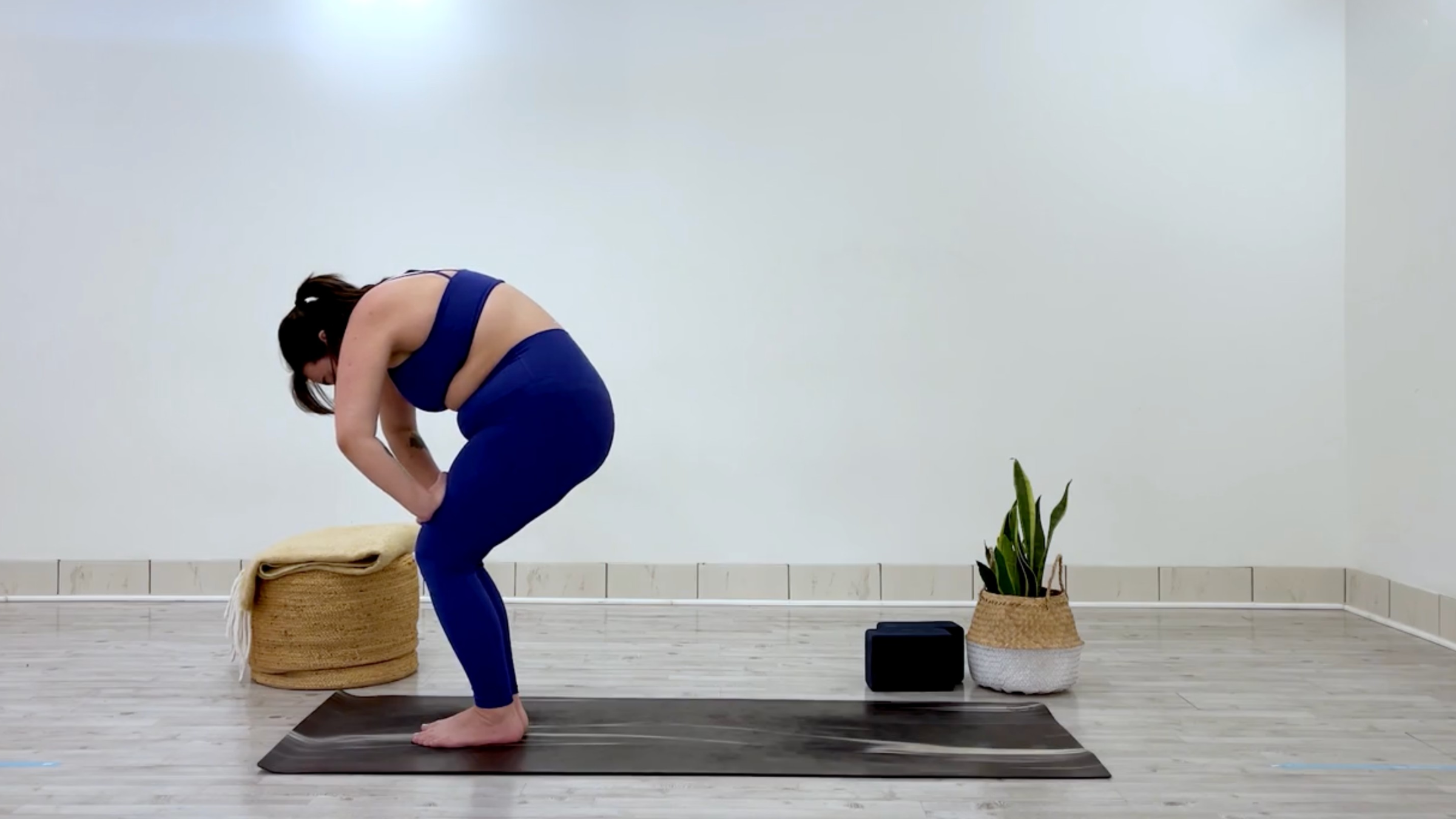 Yoga teacher Taylor Lorenz in chair pose