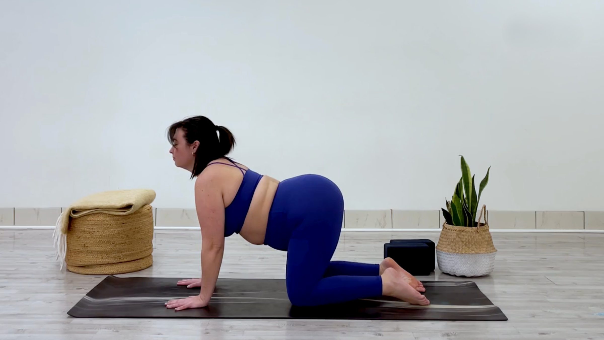 Yoga teacher Taylor Lorenz in cow pose