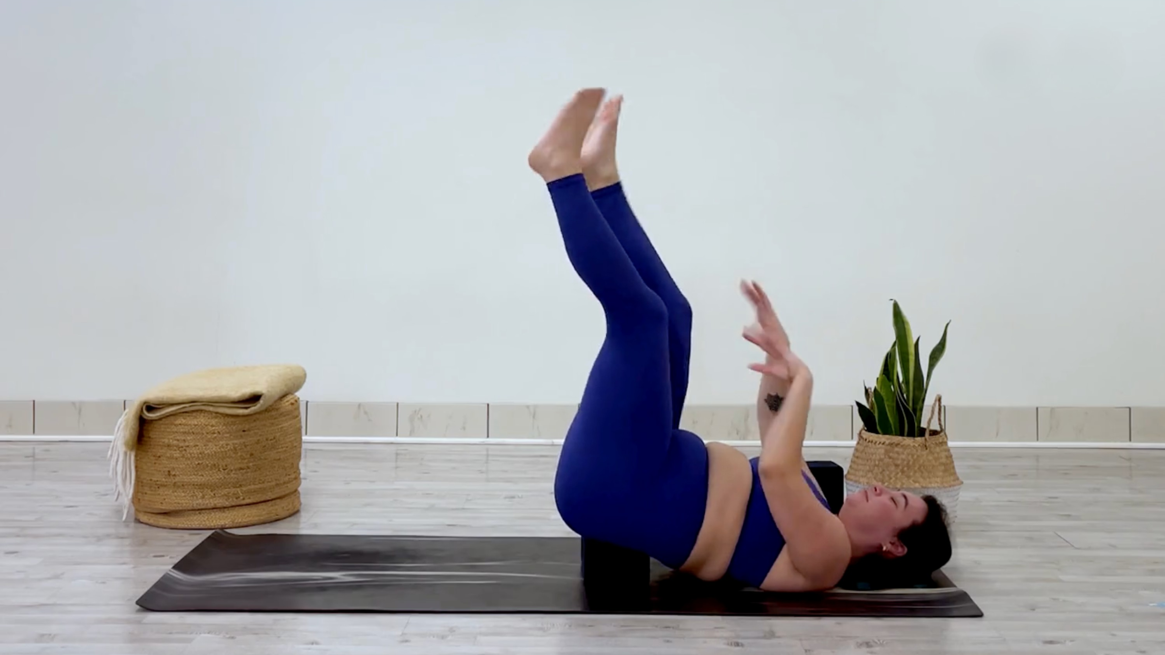 Yoga teacher Taylor Lorenz in waterfall pose