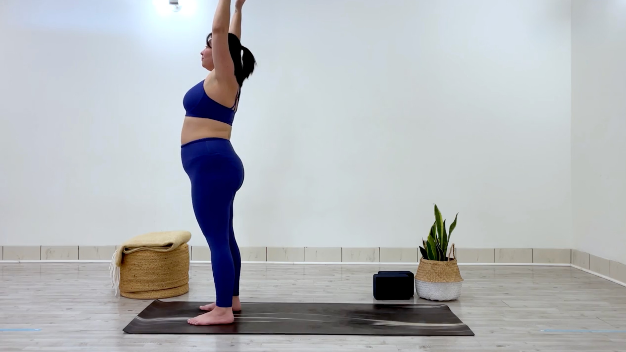 Yoga teacher Taylor Lorenz in the overhead salute