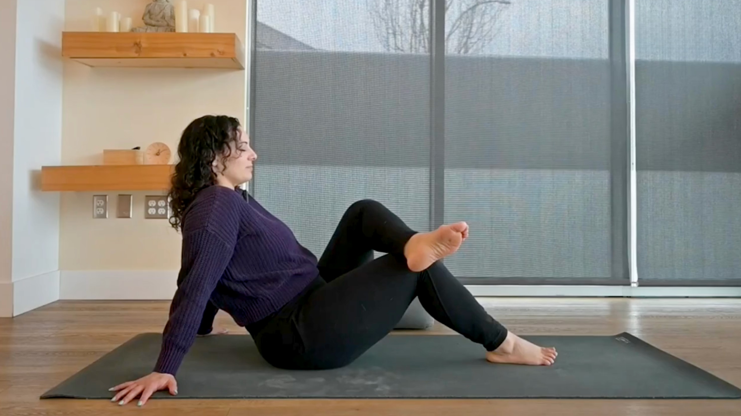 Yoga teacher Audriana Monteiro in Reclined Pigeon Pose, part of her positive affirmations yoga practice