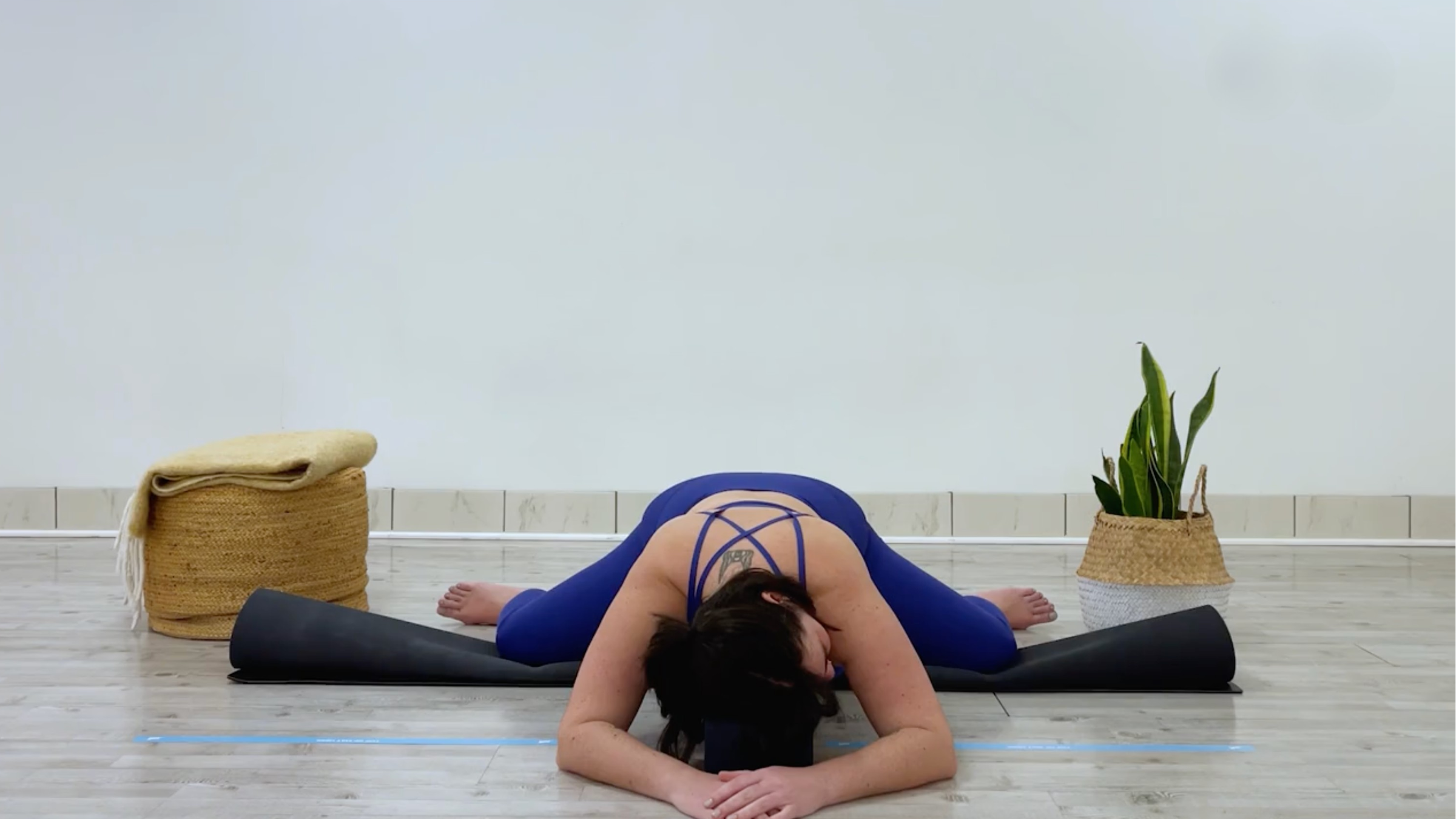 Teacher Taylor Lorenz in frog pose