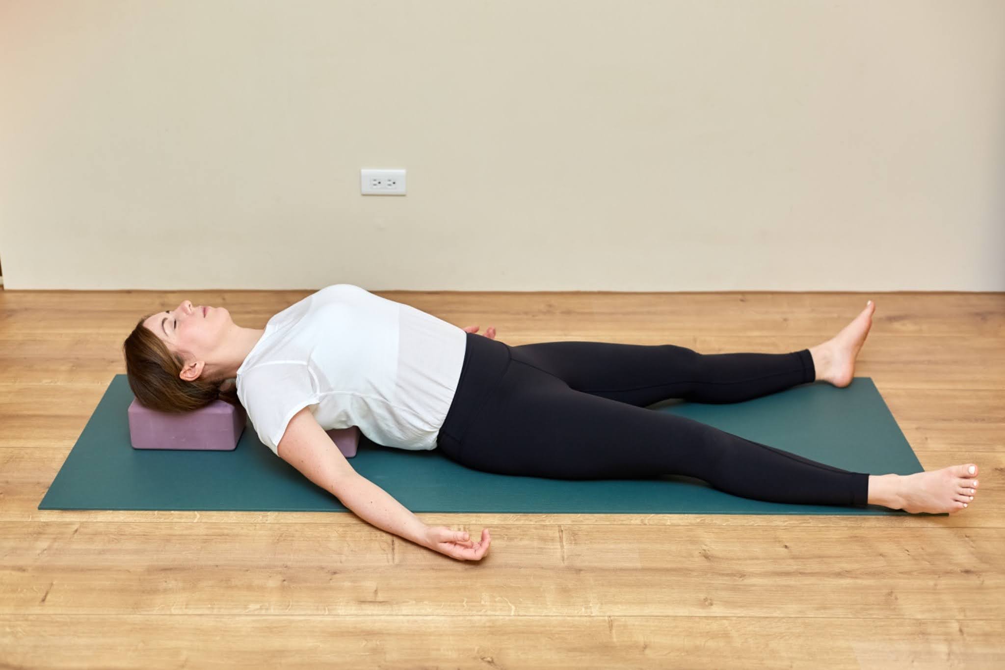 Yoga teacher Katie McGrath in Supported Fish Pose