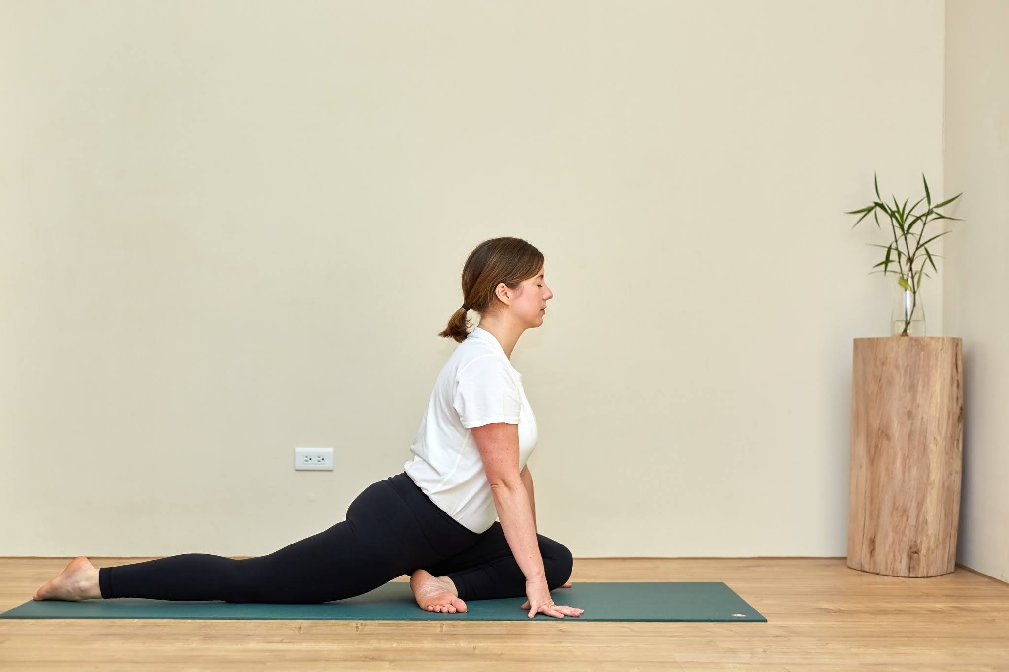 Yoga teacher Katie McGrath in Swan Pose, one of her yin yoga poses to unwind