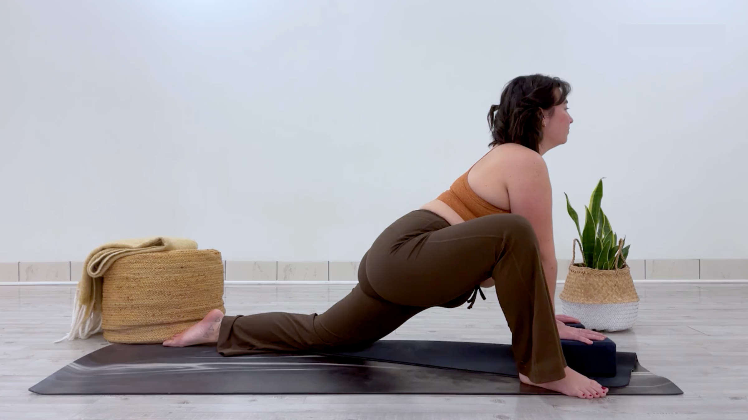 Teacher Taylor Lorenz in Dragon Pose