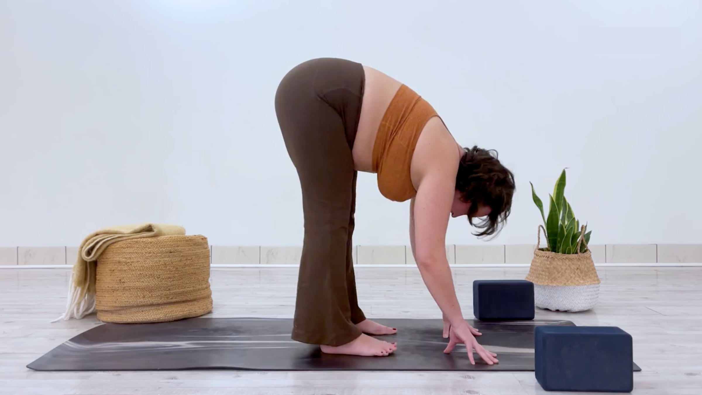 Teacher Taylor Lorenz in Standing Forward Bend