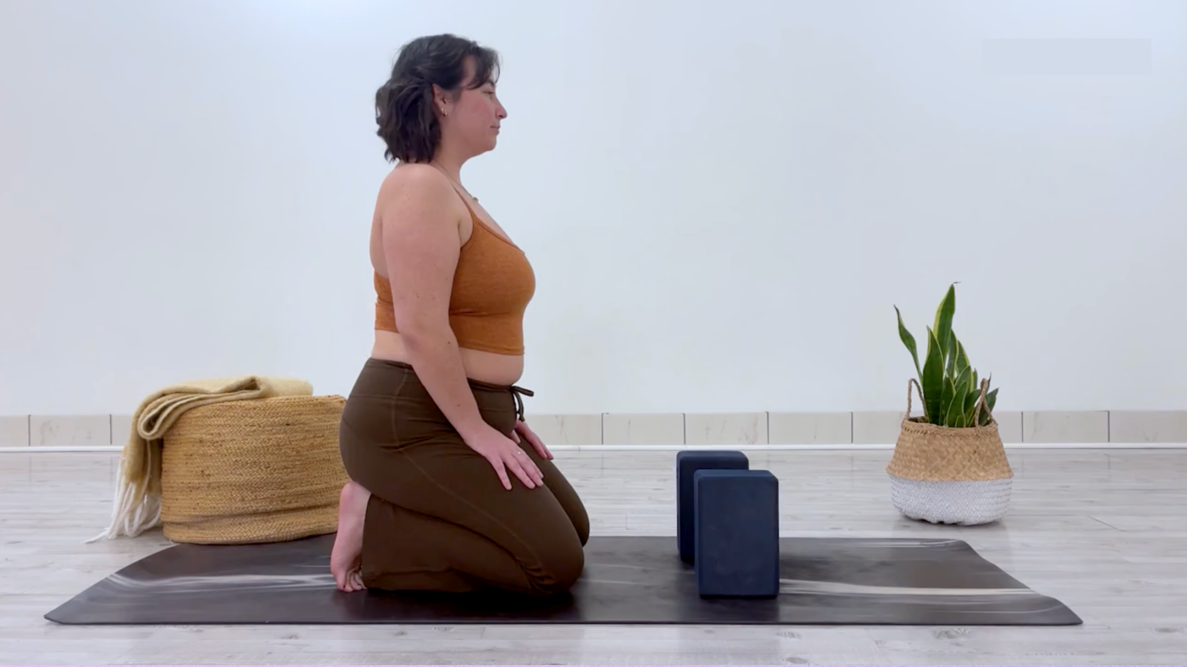 Yoga teacher Taylor Lorenz in Toe Squat, part of her yin yoga for energy practice