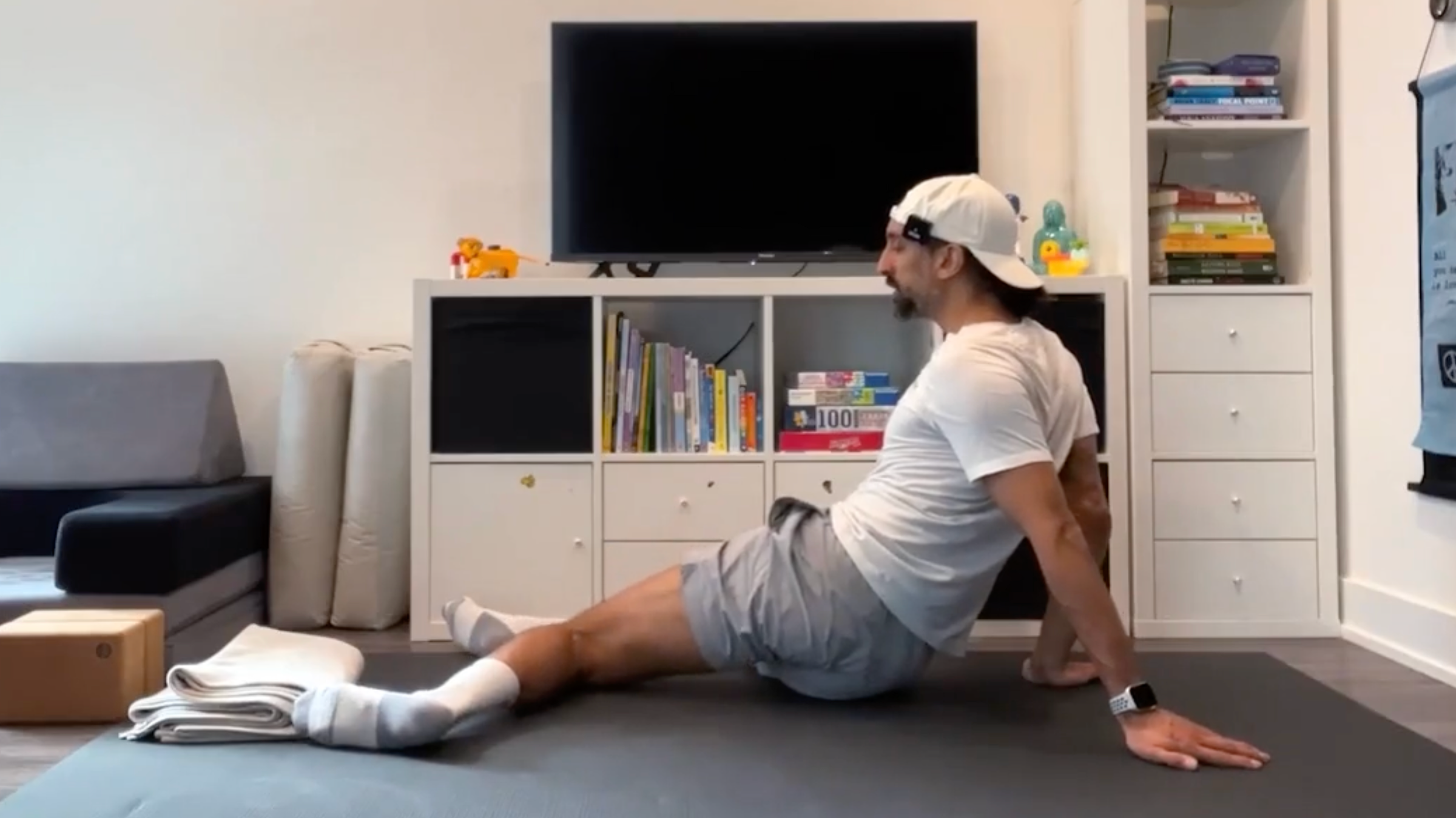 Yoga teacher Jaafar Hussain wears windshield wipers, part of his yoga exercises for the hips