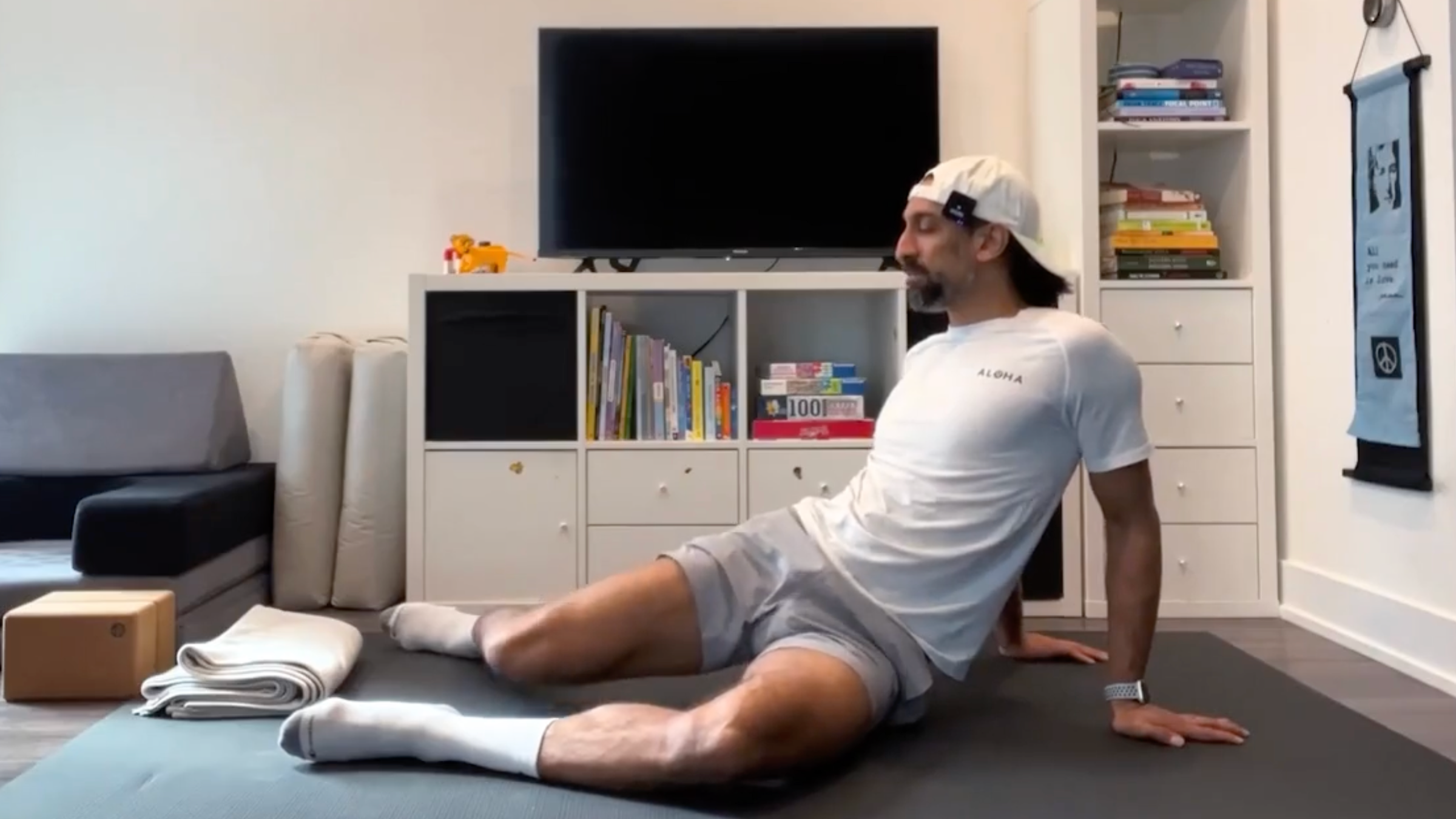 Yoga teacher Jaafar Hussain wears windshield wipers, part of his yoga exercises for the hips