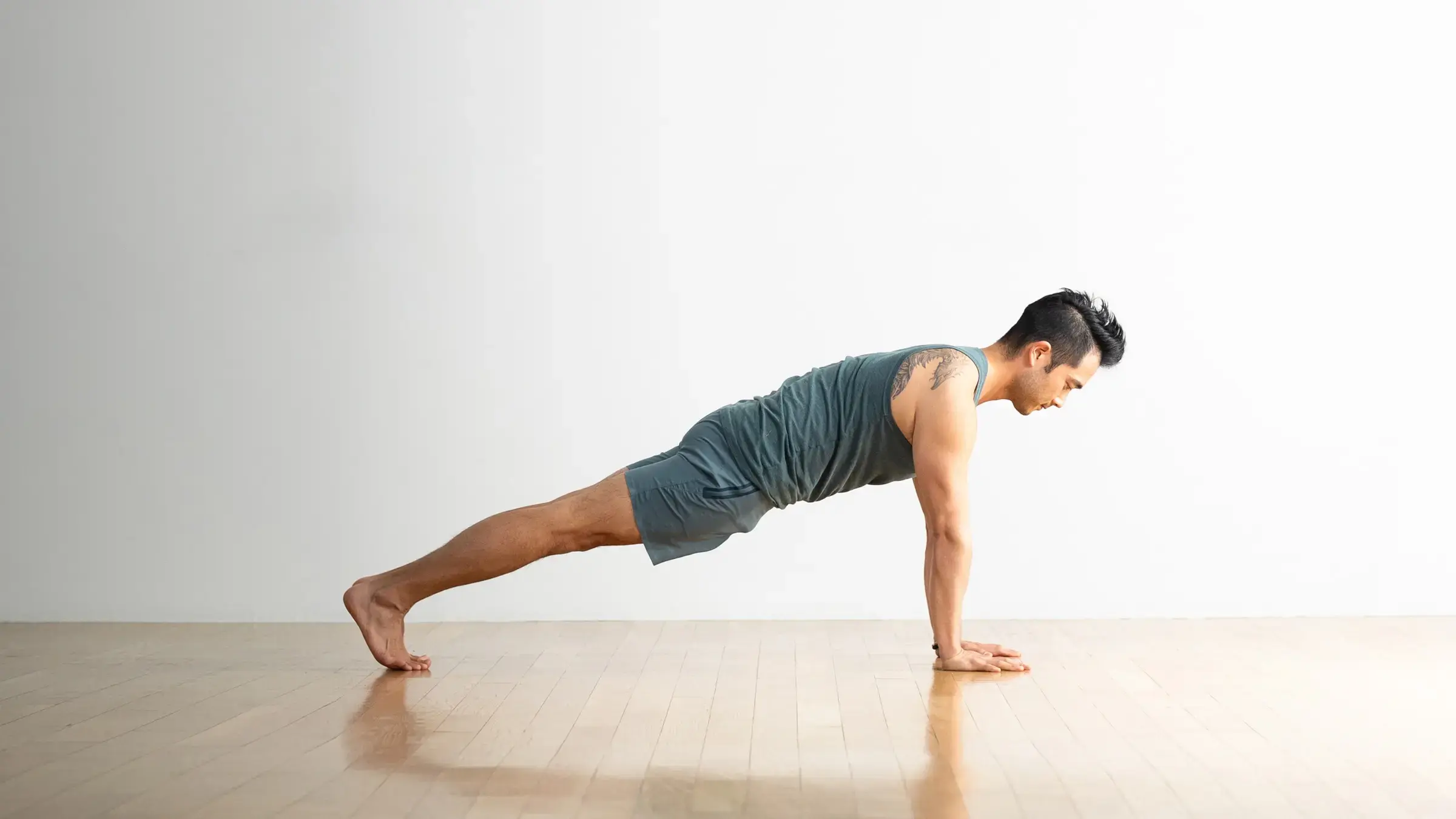 A man in Plank Pose, a yoga for stretch posture