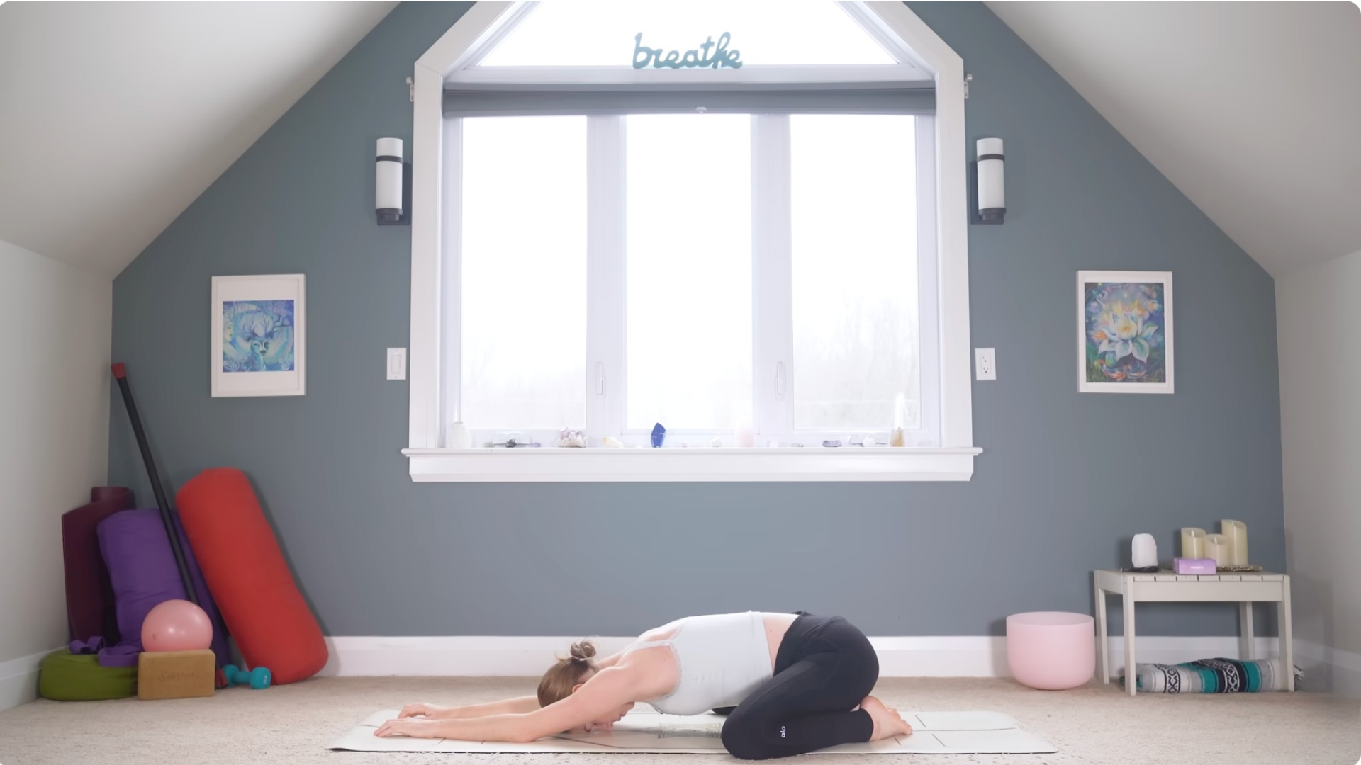 Woman in Child's Pose on a yoga mat