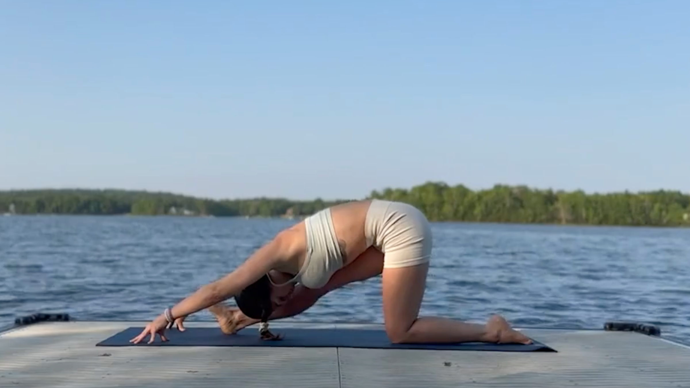 Yoga teacher Emily Baltzer in Half Splits, part of her 10-minute yoga practice for a full-body stretch
