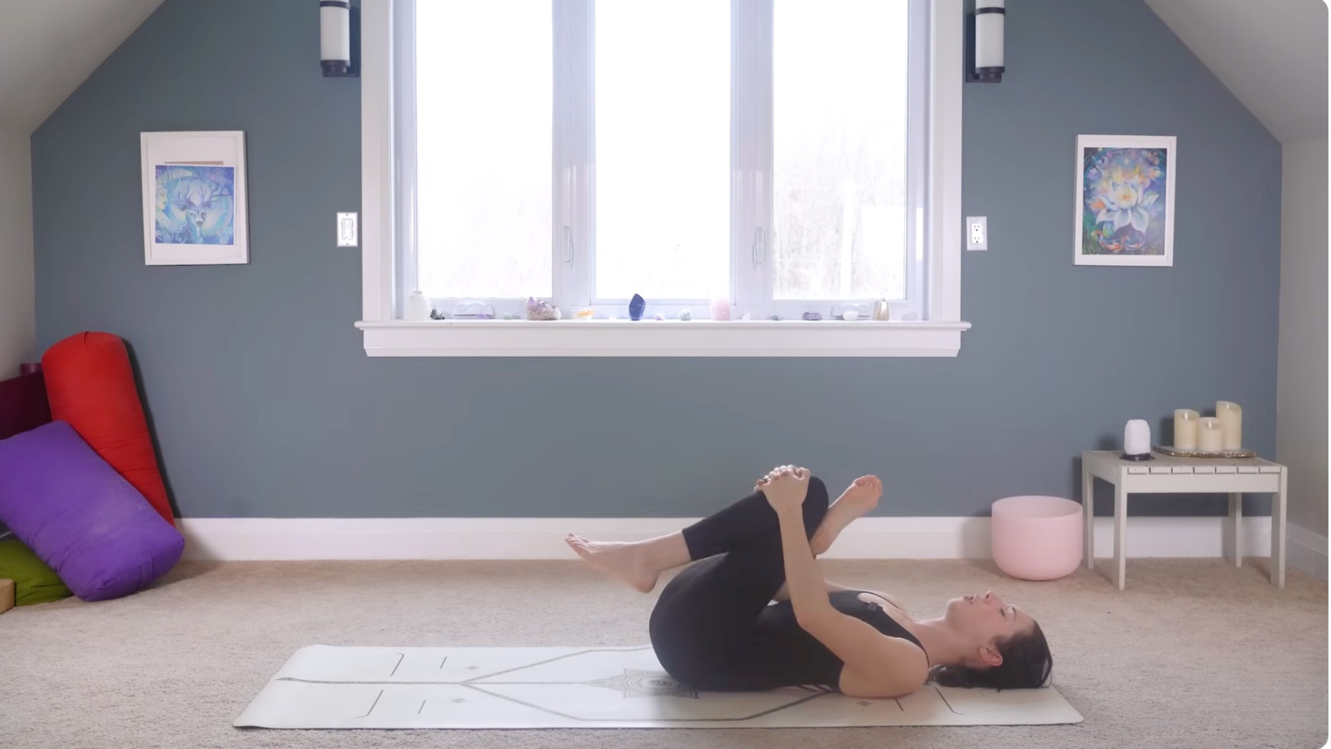 Woman lying on her back practicing Reclined Pigeon Pose or Figure-4 Stretch
