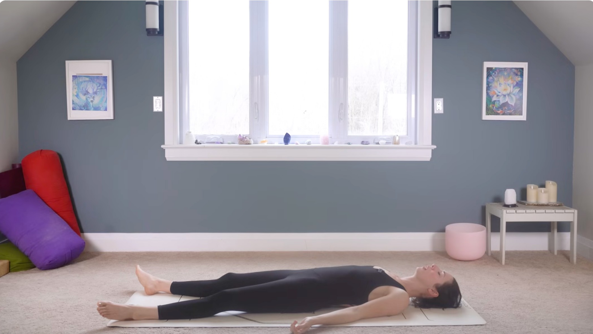 Woman lying back in Savasana