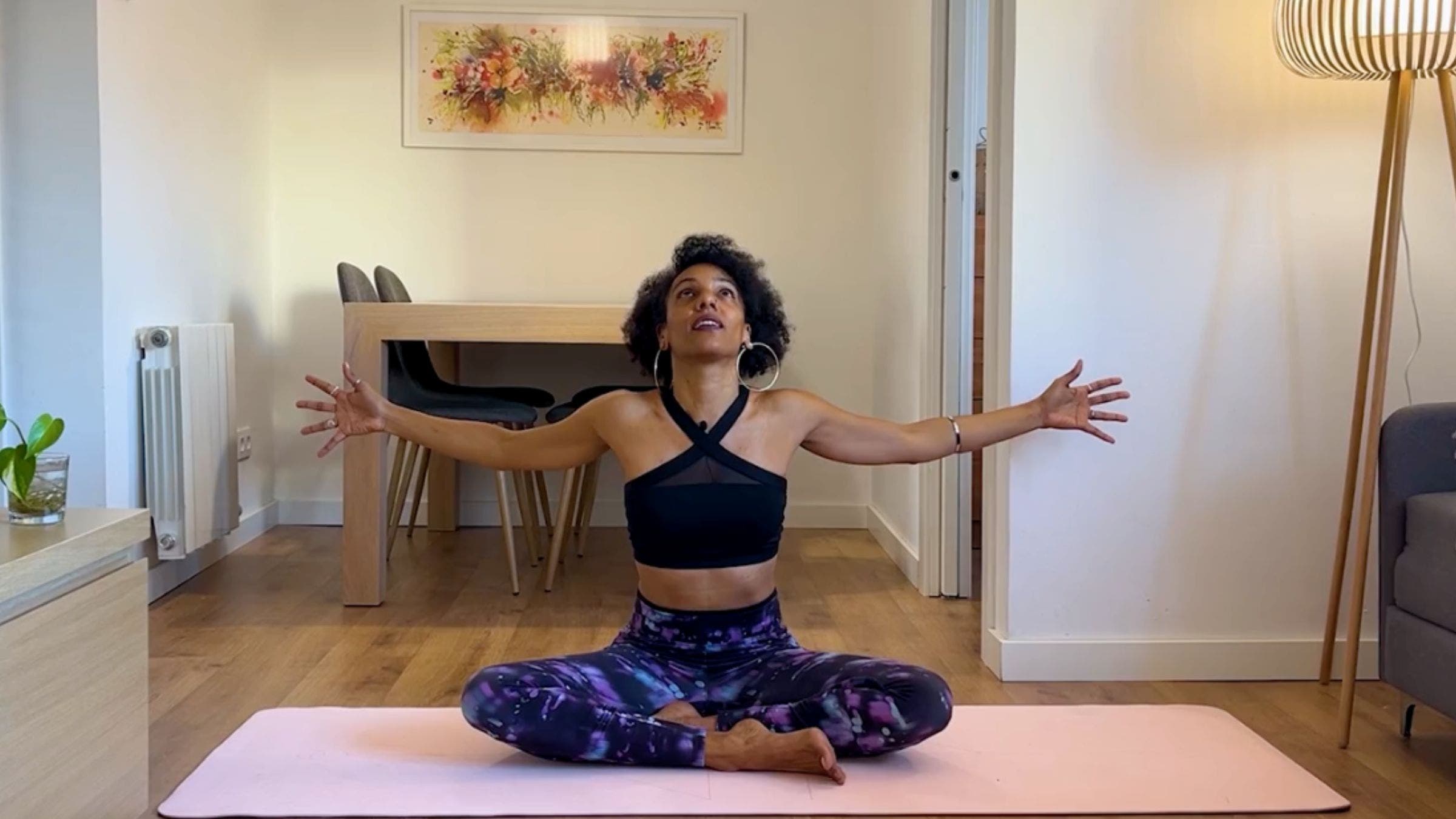 Yoga instructor practicing seated Cow Pose.