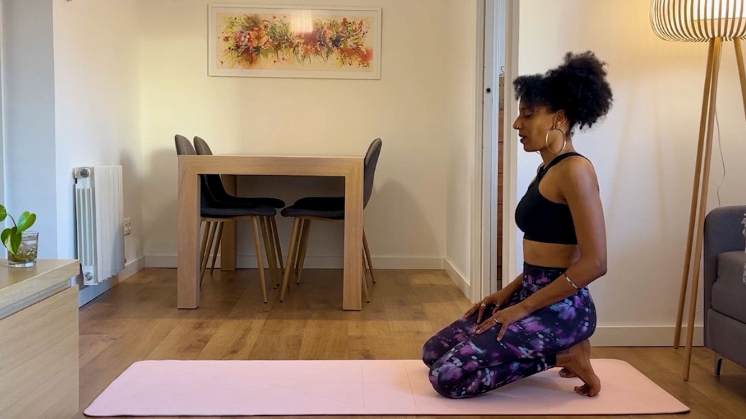 Yoga teacher practicing Toe Squat.