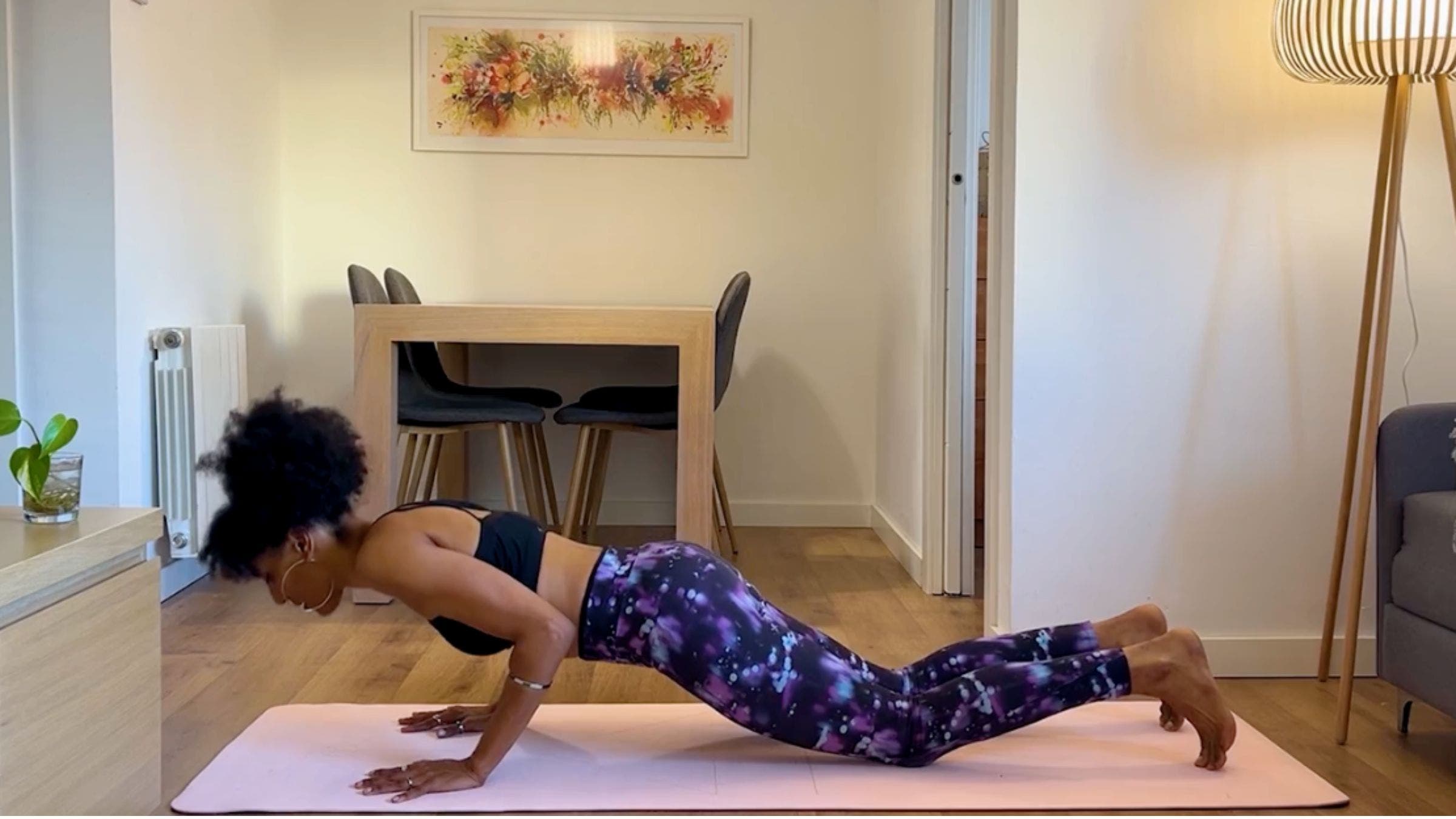 Yoga teacher practicing Chaturanga variation.