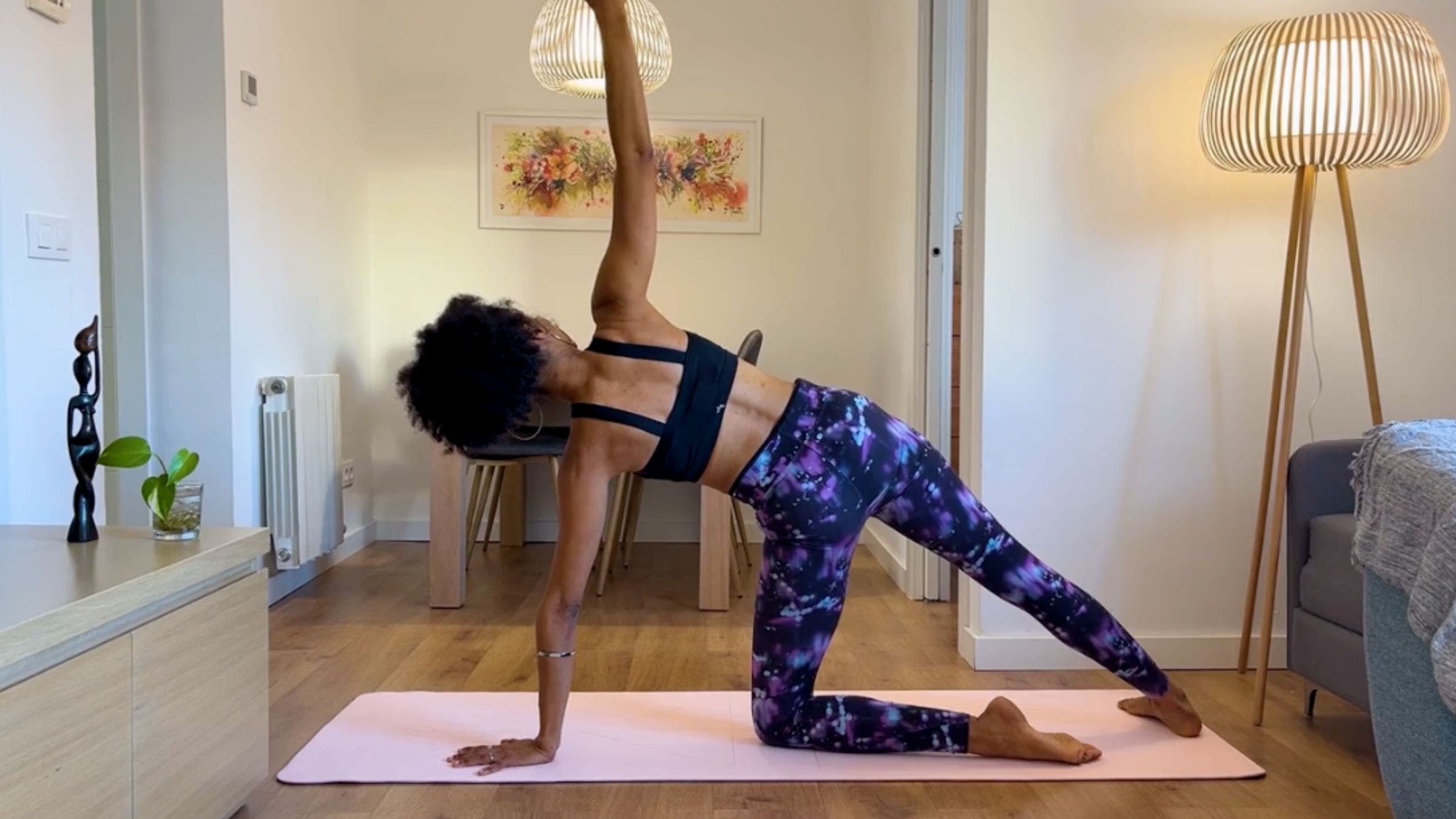 Yoga teacher practicing Side Plank variation.